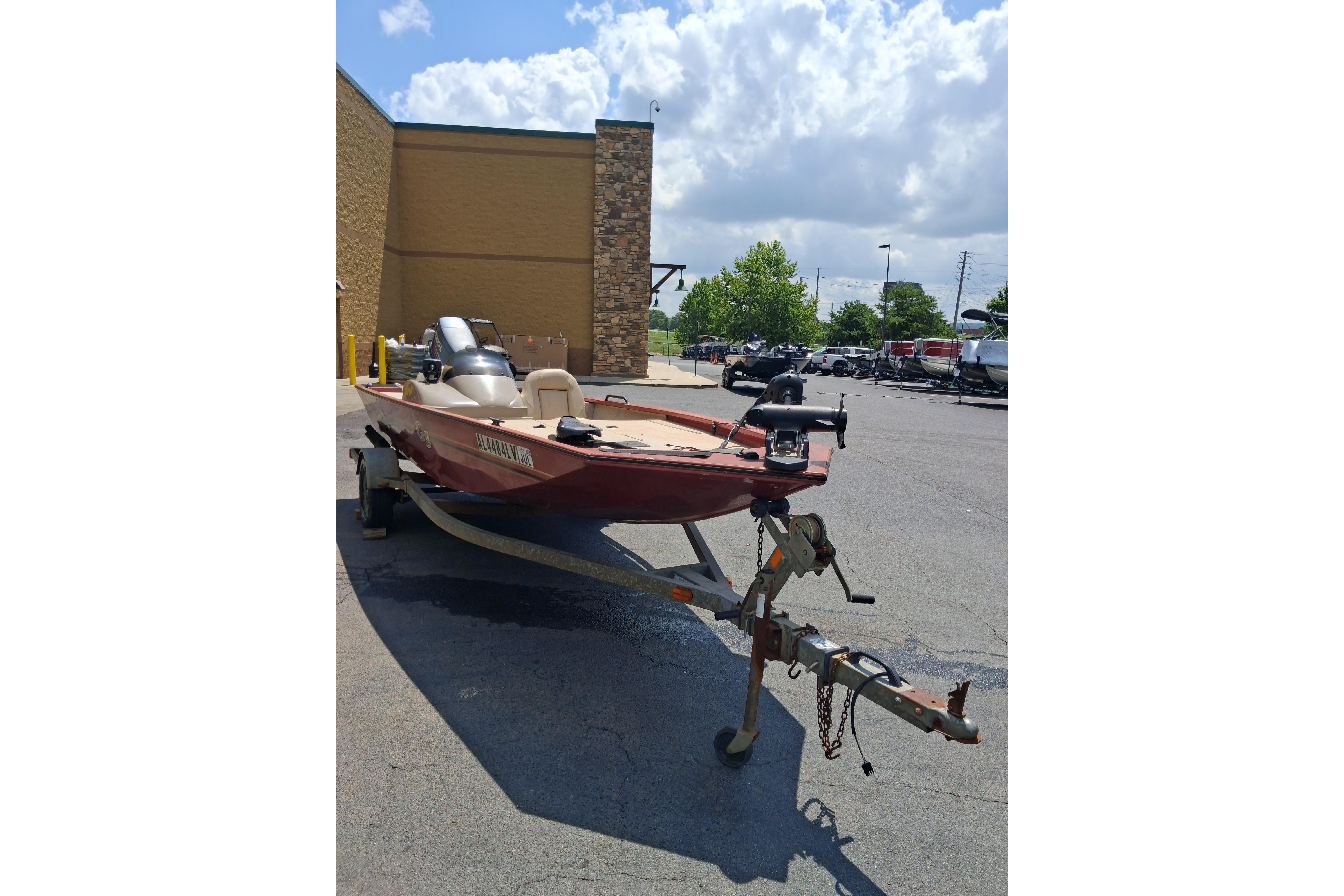 2008 G3 Eagle 175 boat on trailer in parking lot under cloudy sky.
