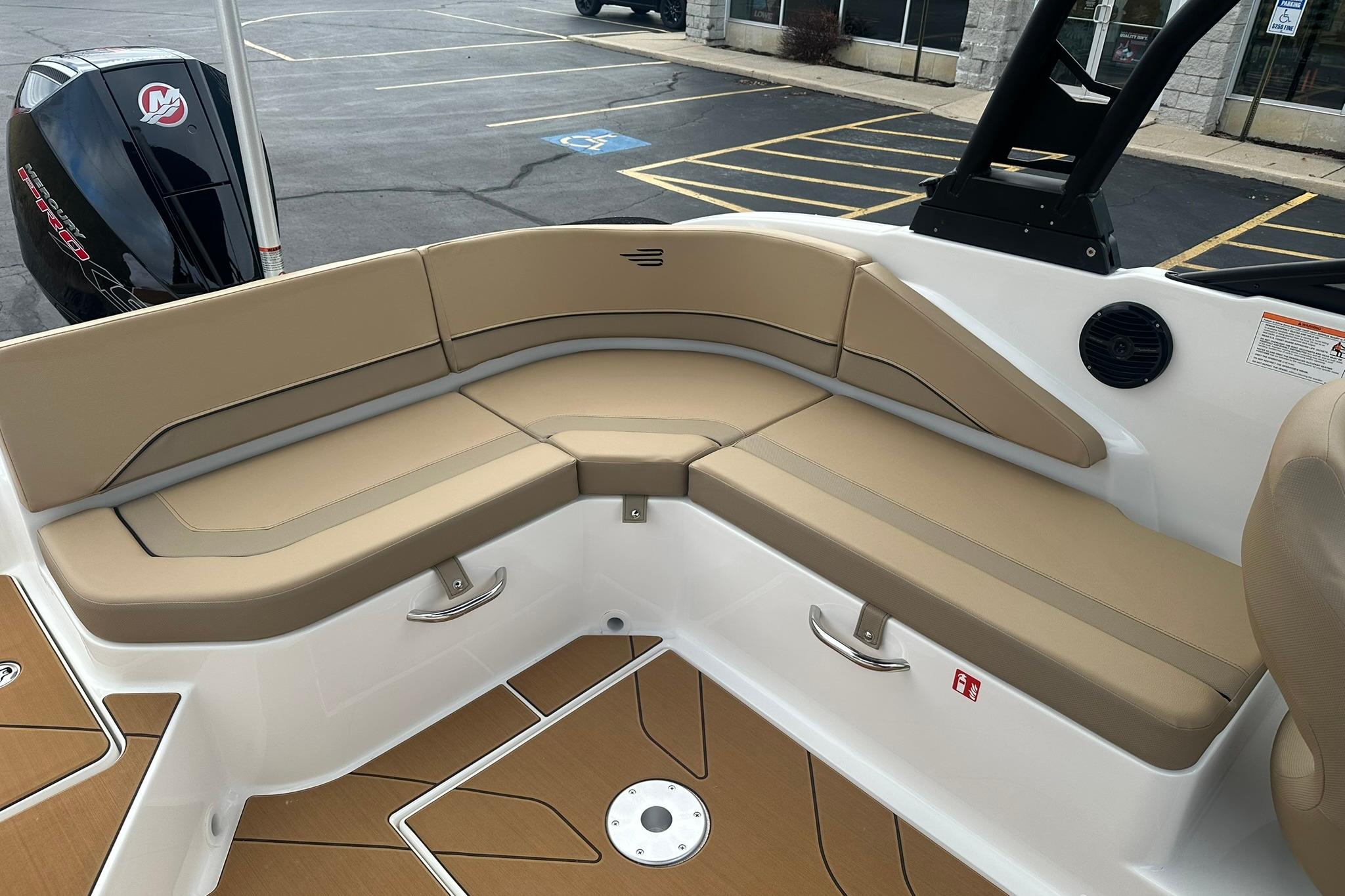 2026 Bayliner V20 boat interior with tan seating and modern design.