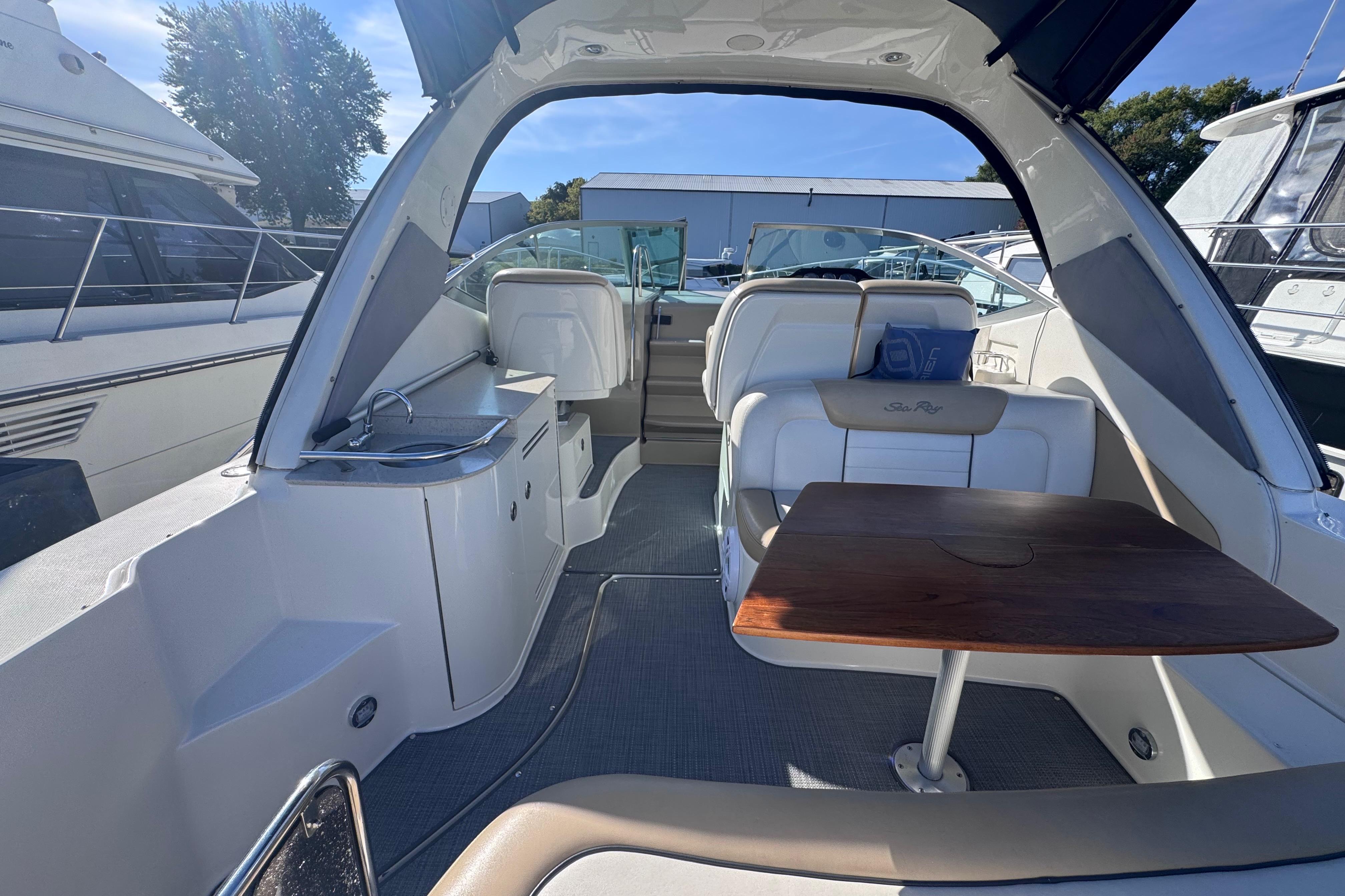Interior view of a 2008 Sea Ray 350 Sundancer yacht with seating and table.