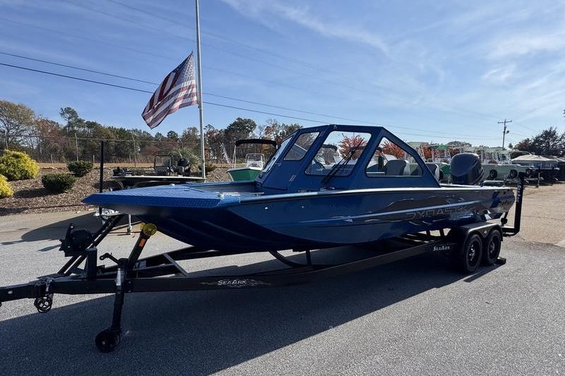 2026 SeaArk Dynasty 2.0 boat on trailer, parked outdoors under clear sky.