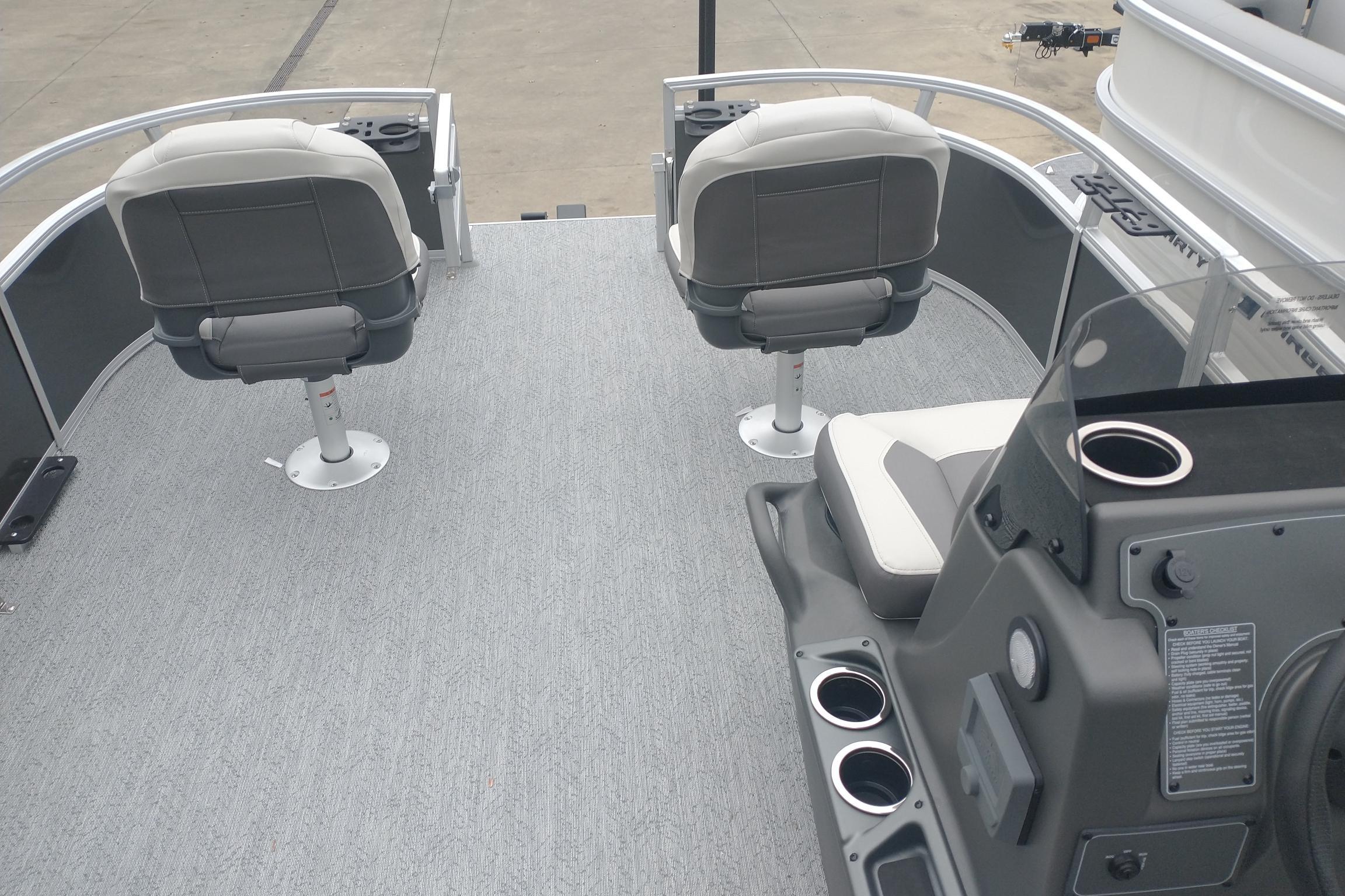 2026 Sun Tracker Bass Buggy 16 XL Select pontoon boat interior with seating and console.