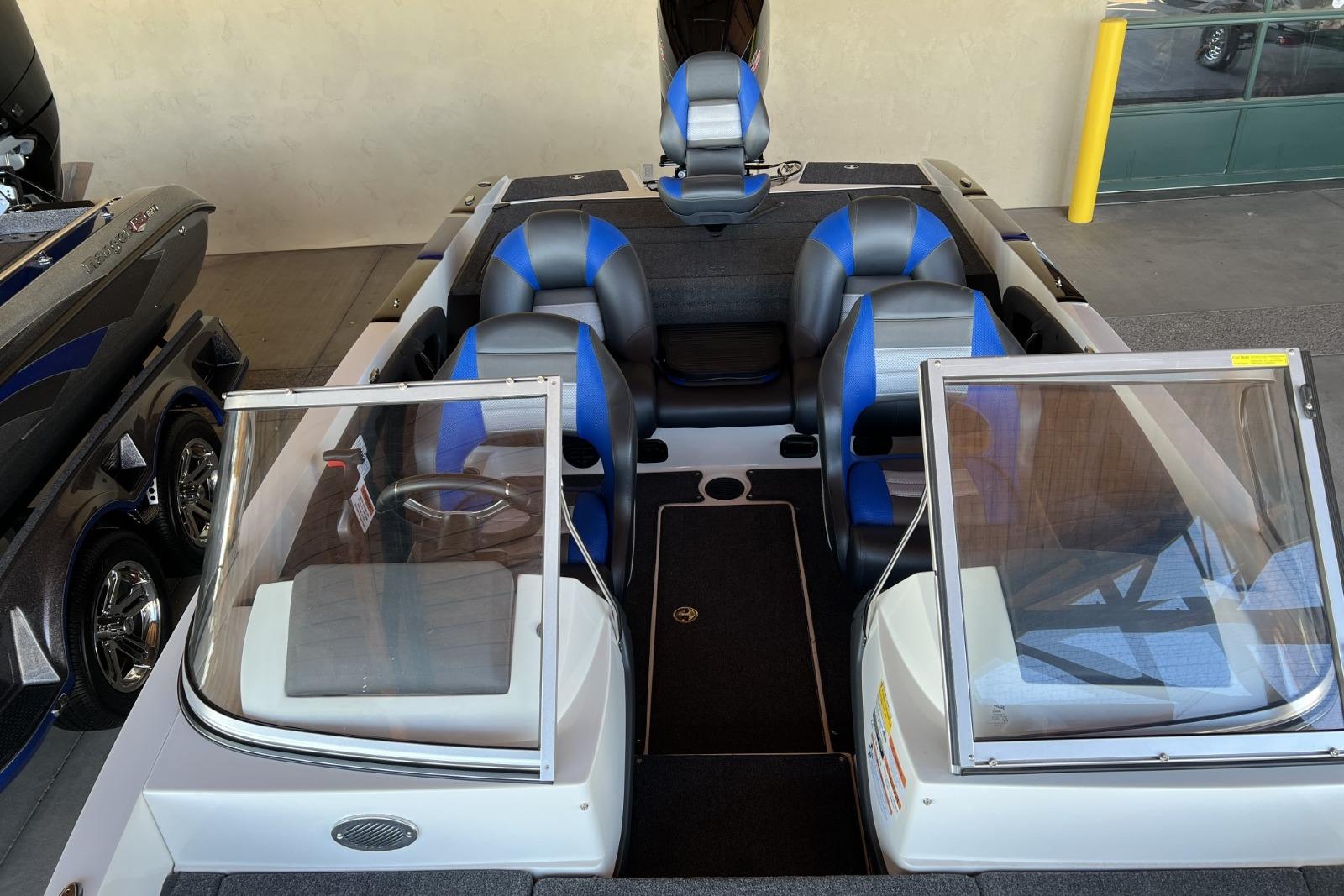 2025 Ranger 212LS boat interior with blue and black seating, dual windshields, and modern design.