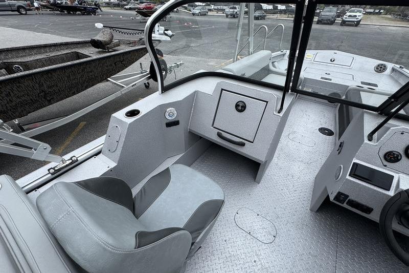 2025 SeaArk Super Lounge Easy boat interior with seating and control panel.