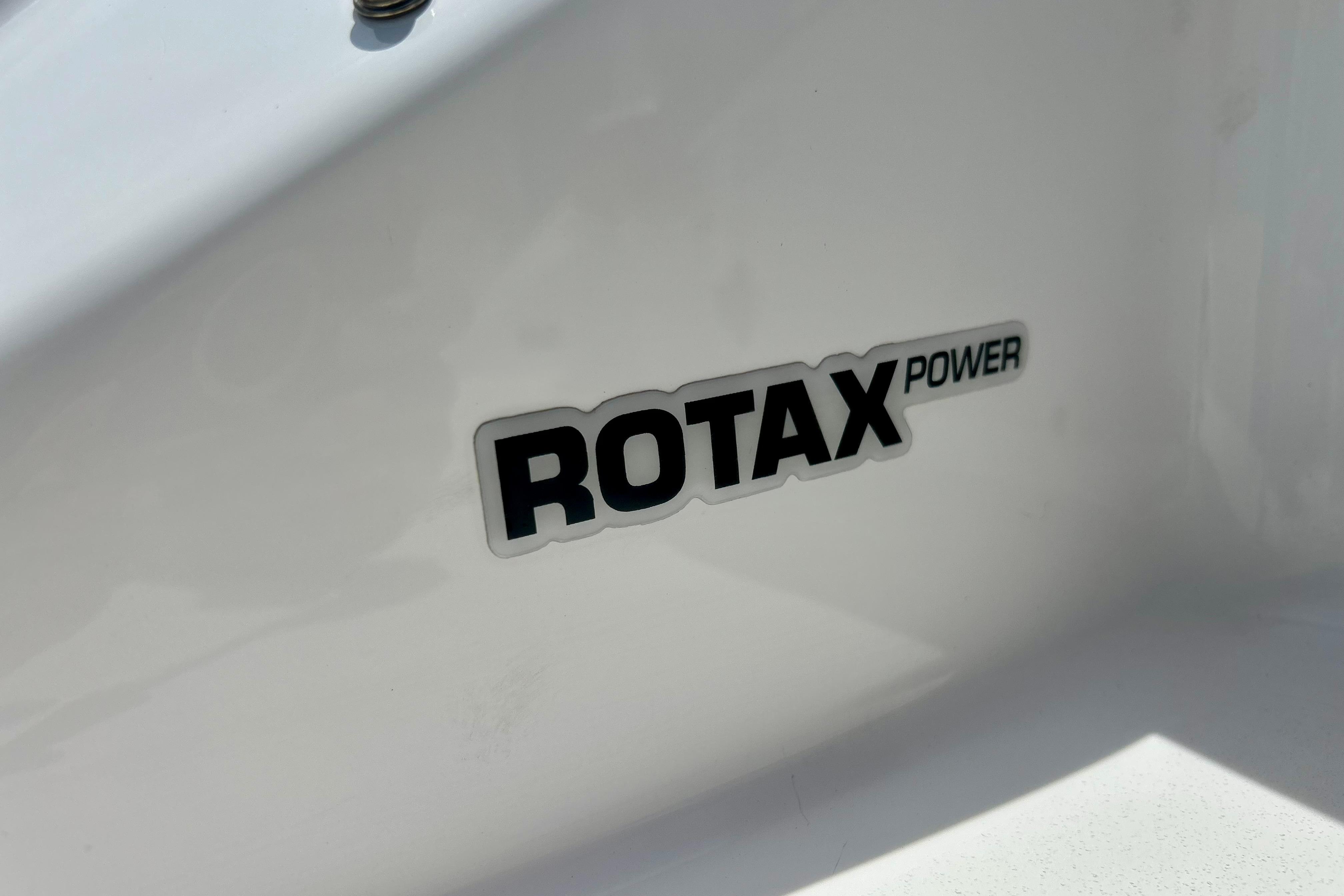 Rotax Power logo on 2021 Scarab 195 ID boat exterior.