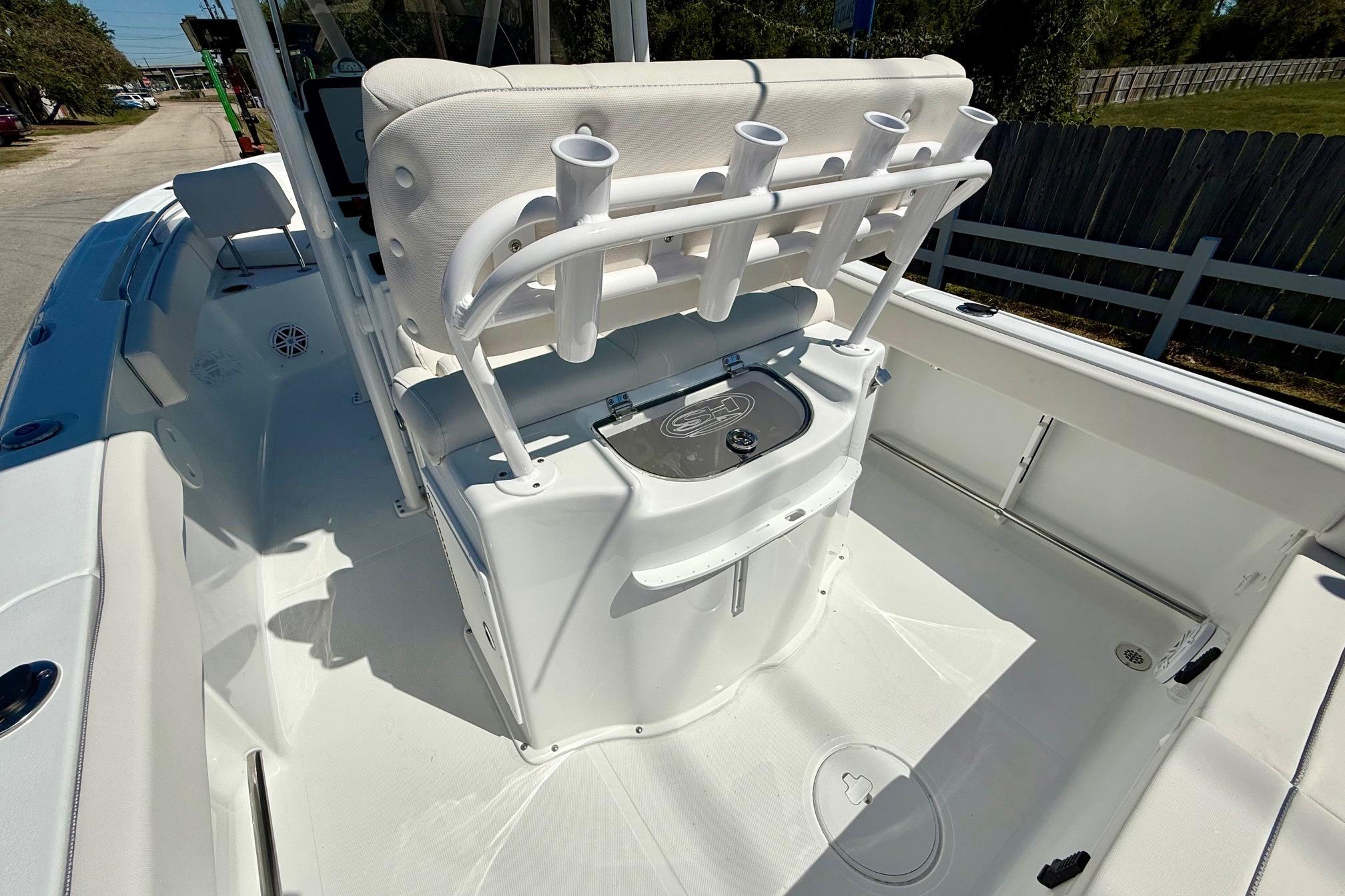 2026 Sea Hunt Ultra 229 boat interior with rod holders and seating.