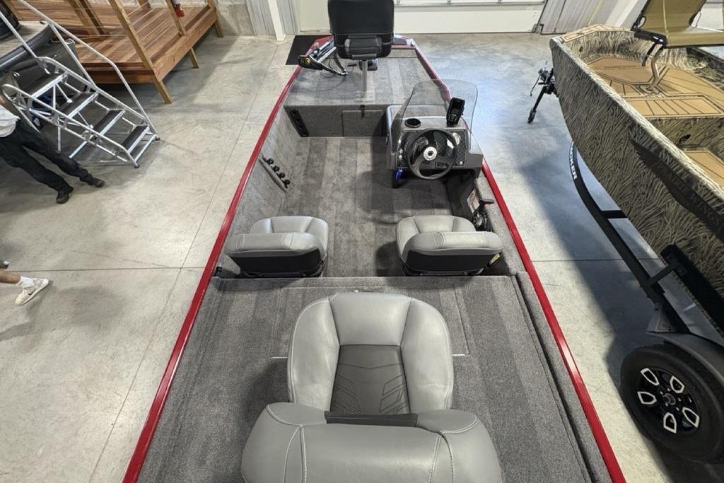 2026 Tracker Bass Tracker Classic XL boat interior with gray seating and steering console.