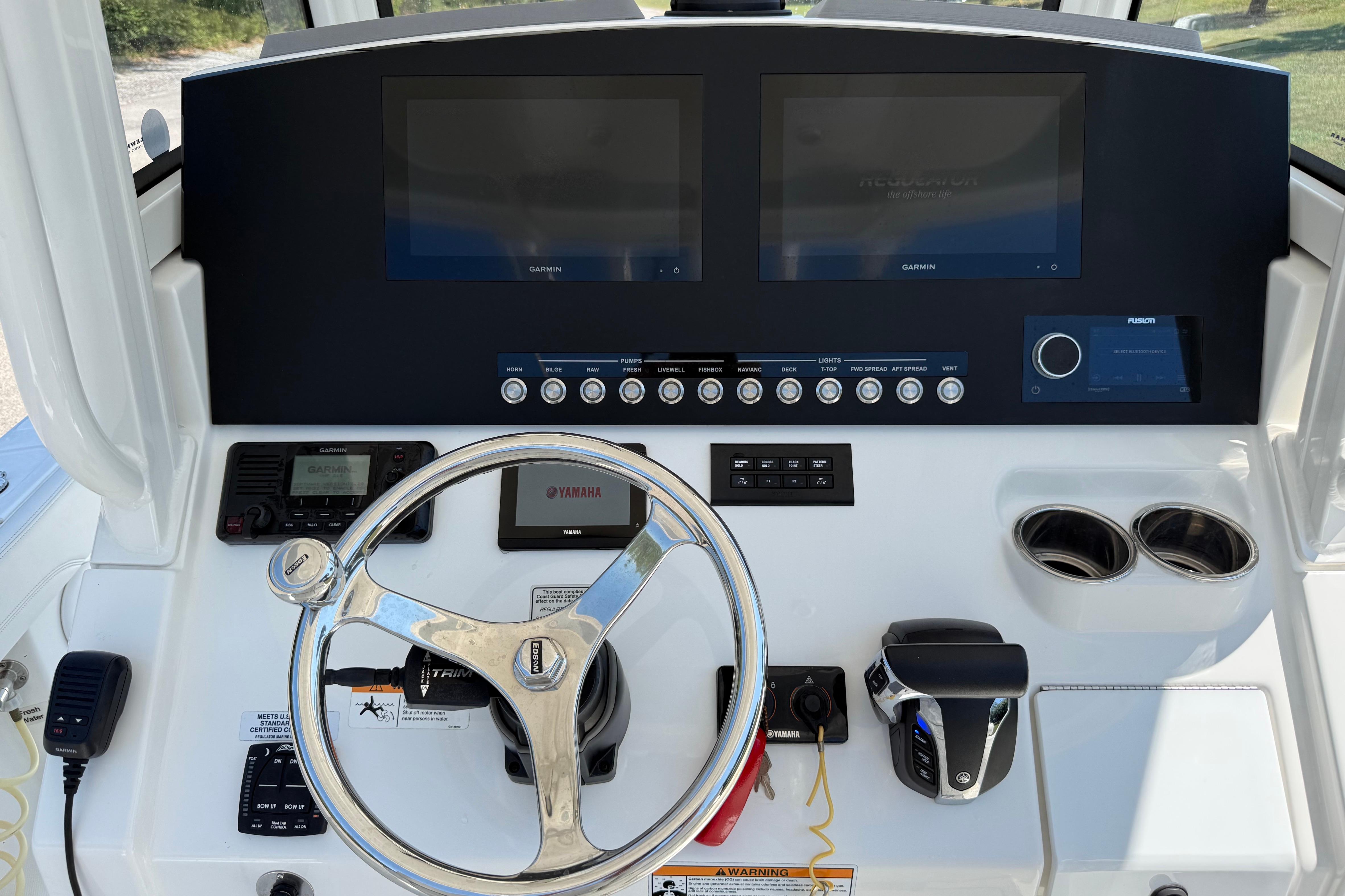 2023 Regulator 26XO boat dashboard with dual Garmin displays and Yamaha controls.