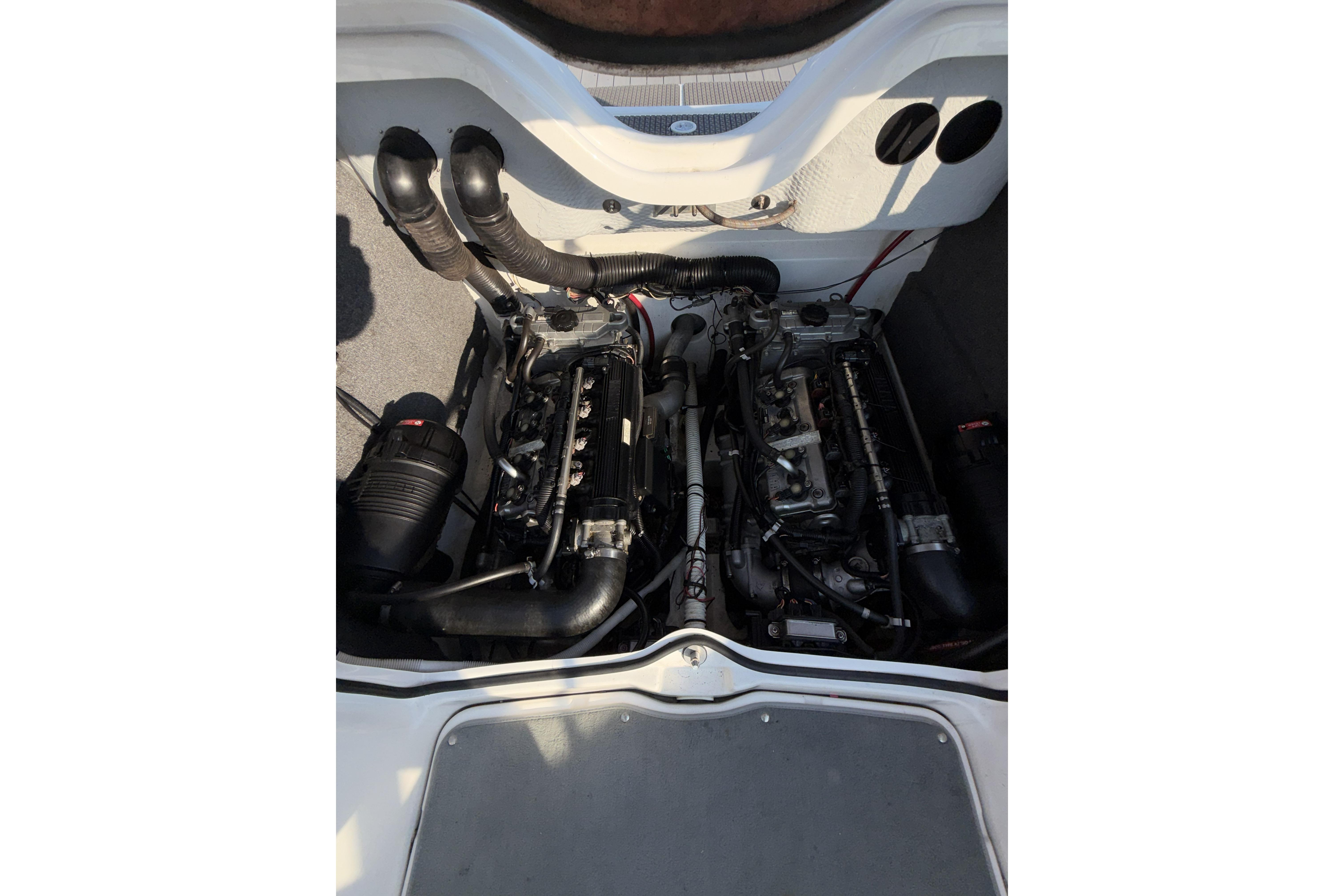 2006 Yamaha Boats SX210 engine compartment with dual engines and exhaust system.