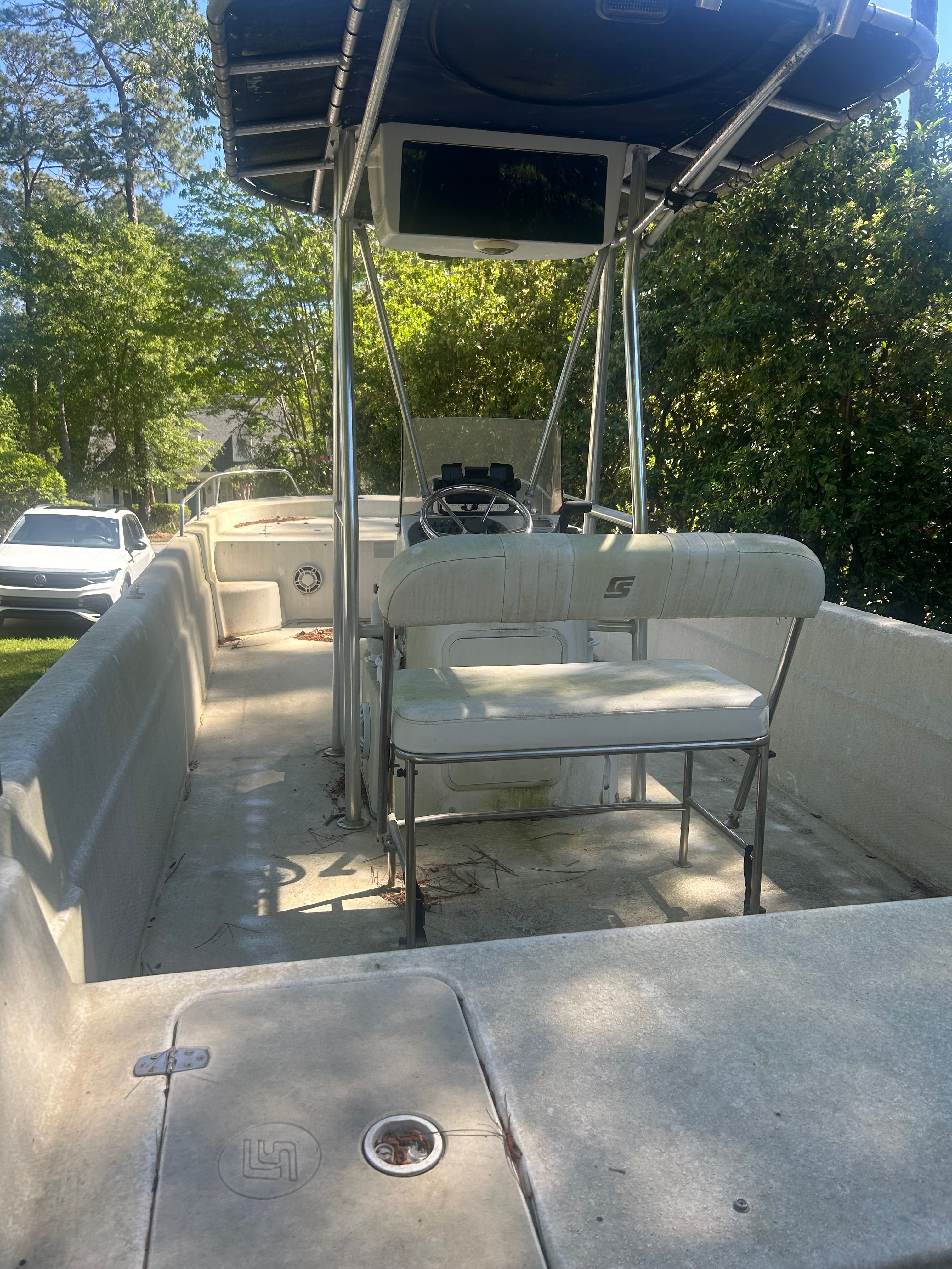 2011 Carolina Skiff 258 DLV boat with open helm station.