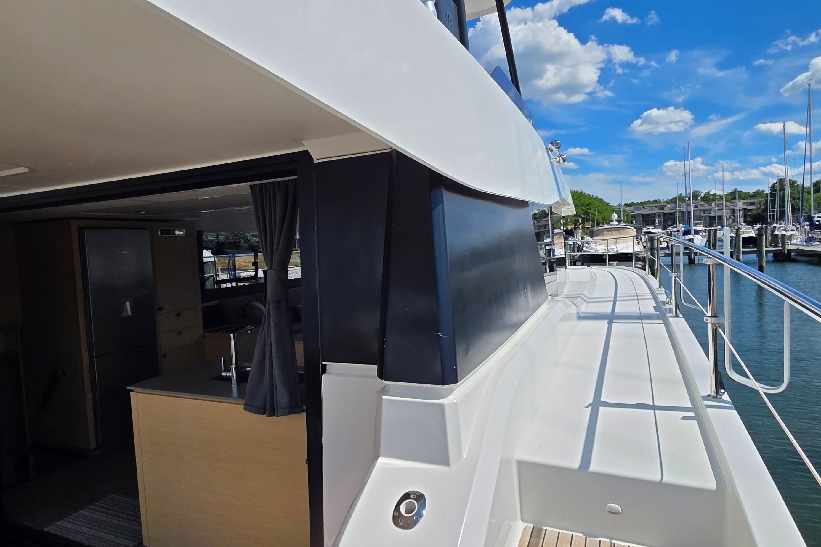 2018 Fountaine Pajot Motor Yacht 44, featuring sleek design and spacious deck, docked at marina.