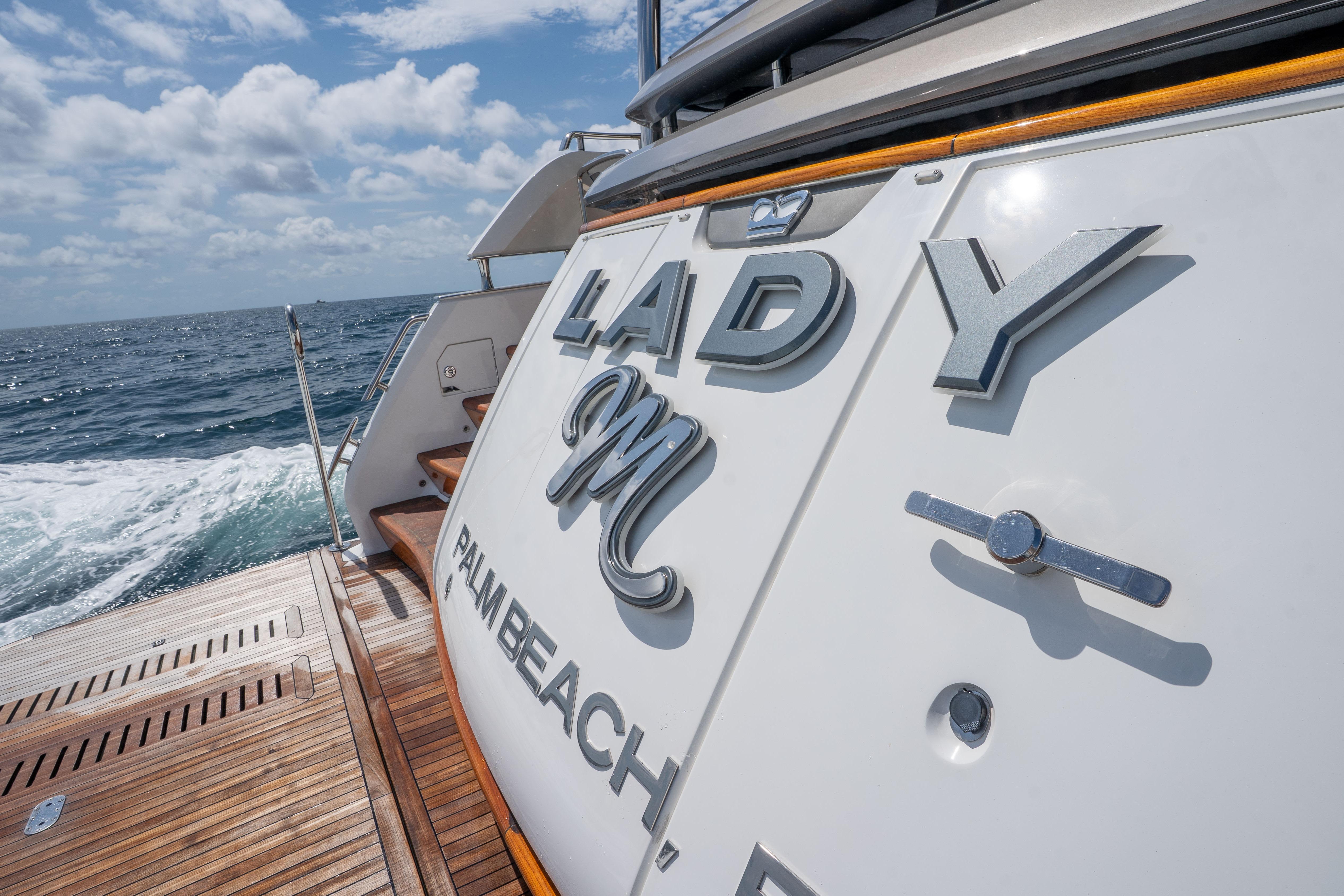 Luxury yacht Princess Y85, 2020 model, cruising on open sea with wooden deck.
