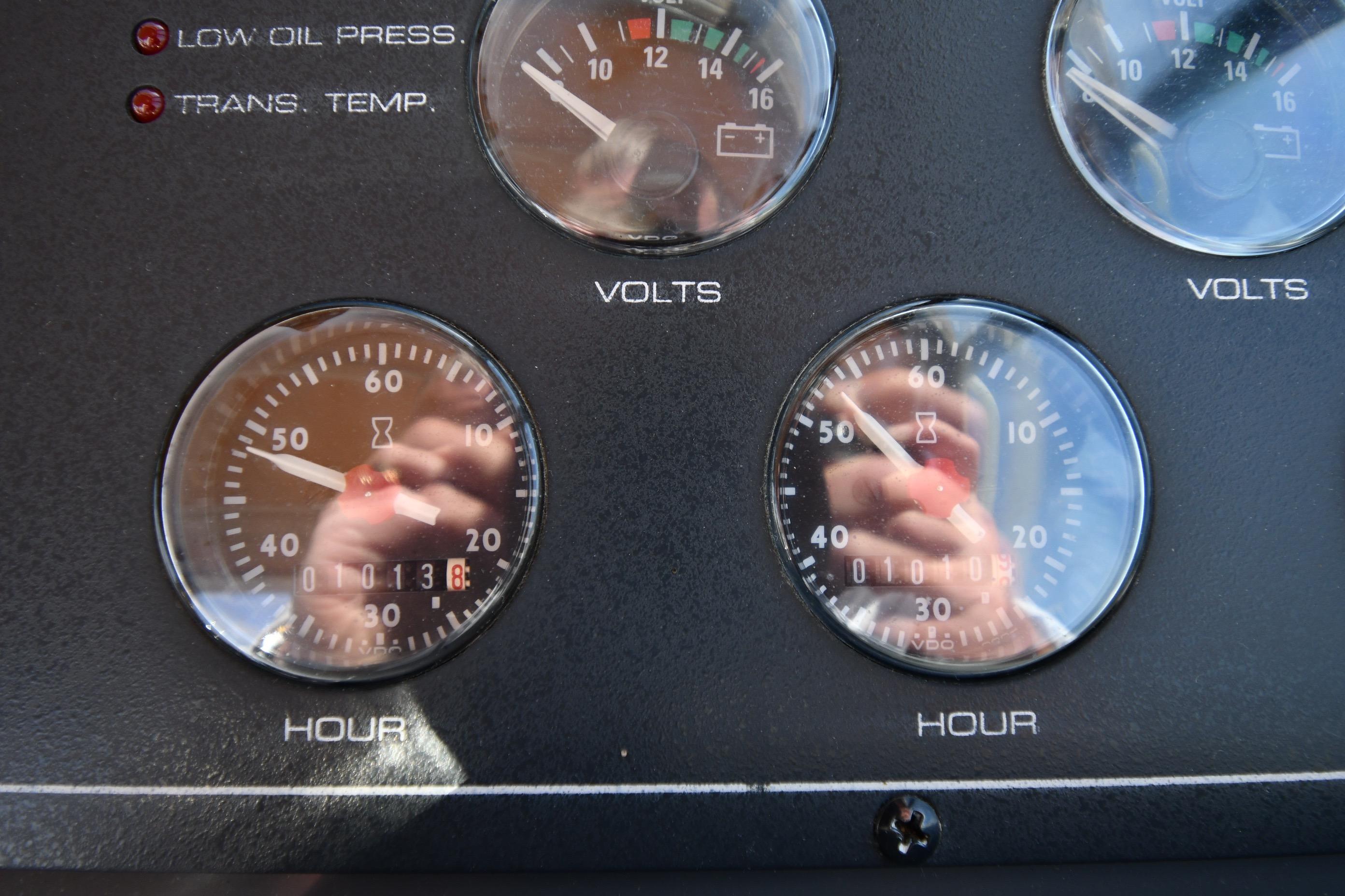 Instrument panel of a 1998 Tiara Yachts 3100 Open, displaying volt and hour gauges.