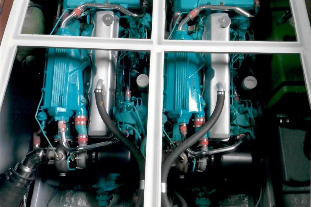 Engine compartment of a 1989 Fairey Spearfish MKIII, showcasing dual blue engines.
