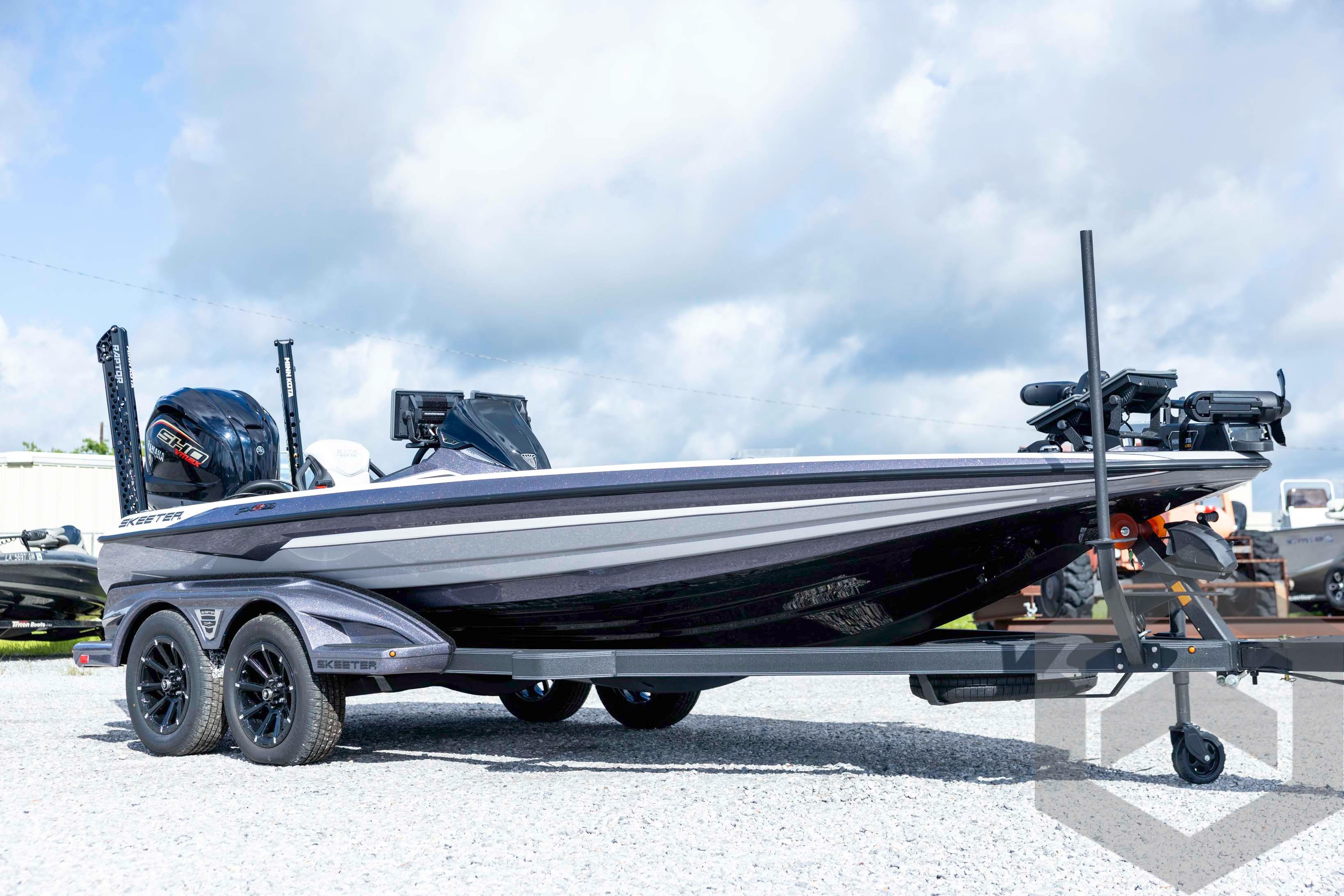 2026 Skeeter FXR20 FLEX boat on trailer, sleek design under cloudy sky.
