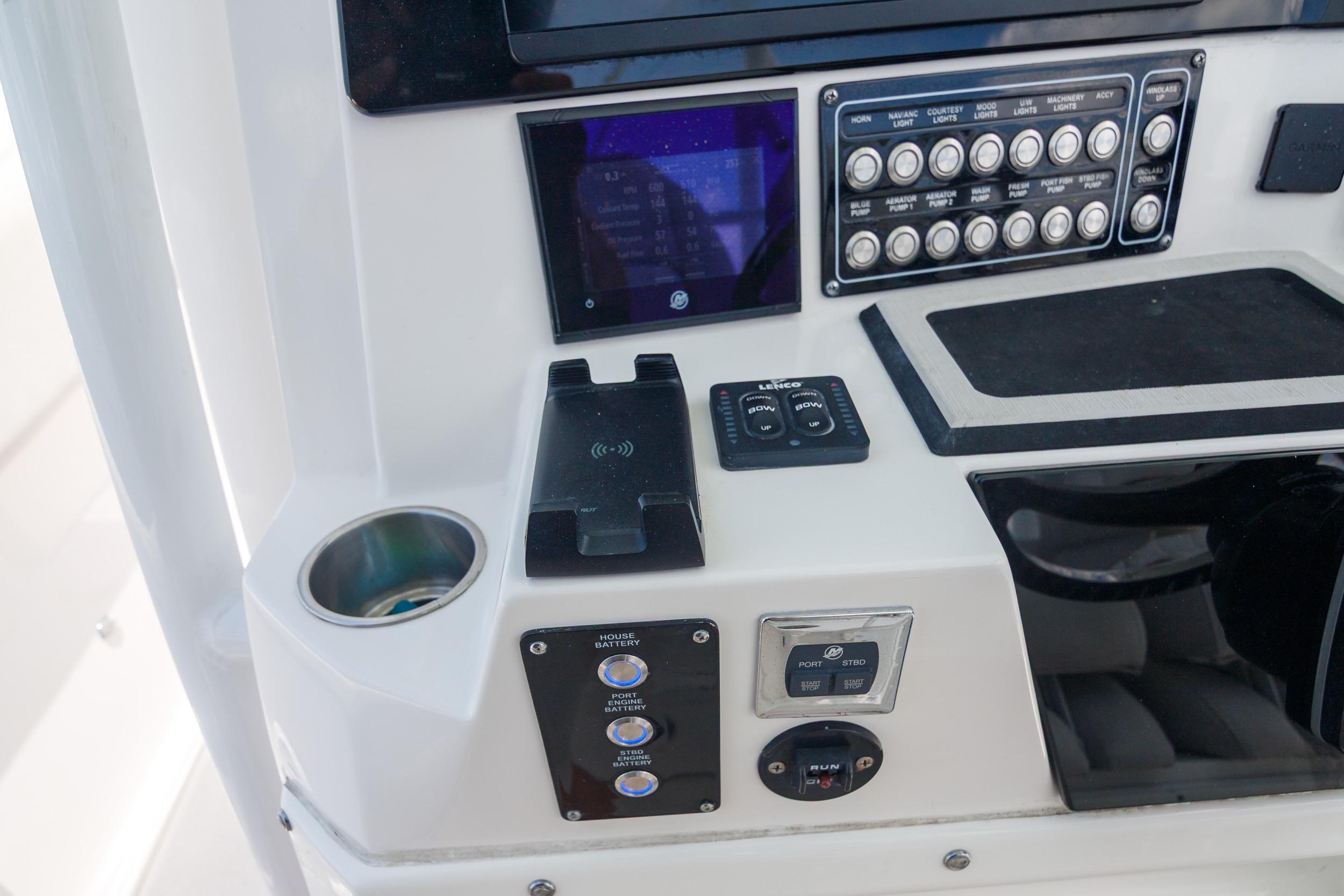 Control panel of a 2021 Sea Fox 328 Commander boat with various switches and displays.