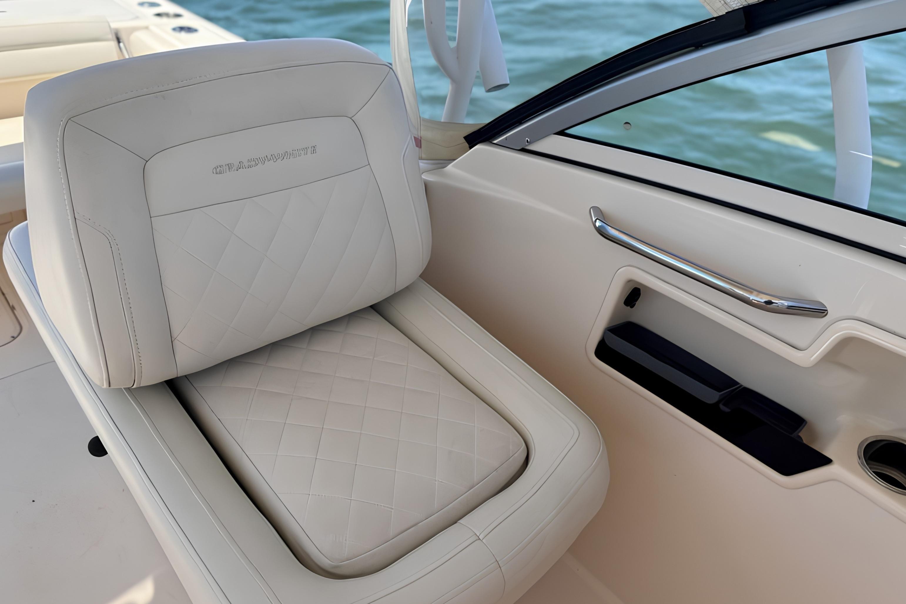 2017 Grady-White Freedom 235 boat seat with quilted upholstery and sleek interior design.