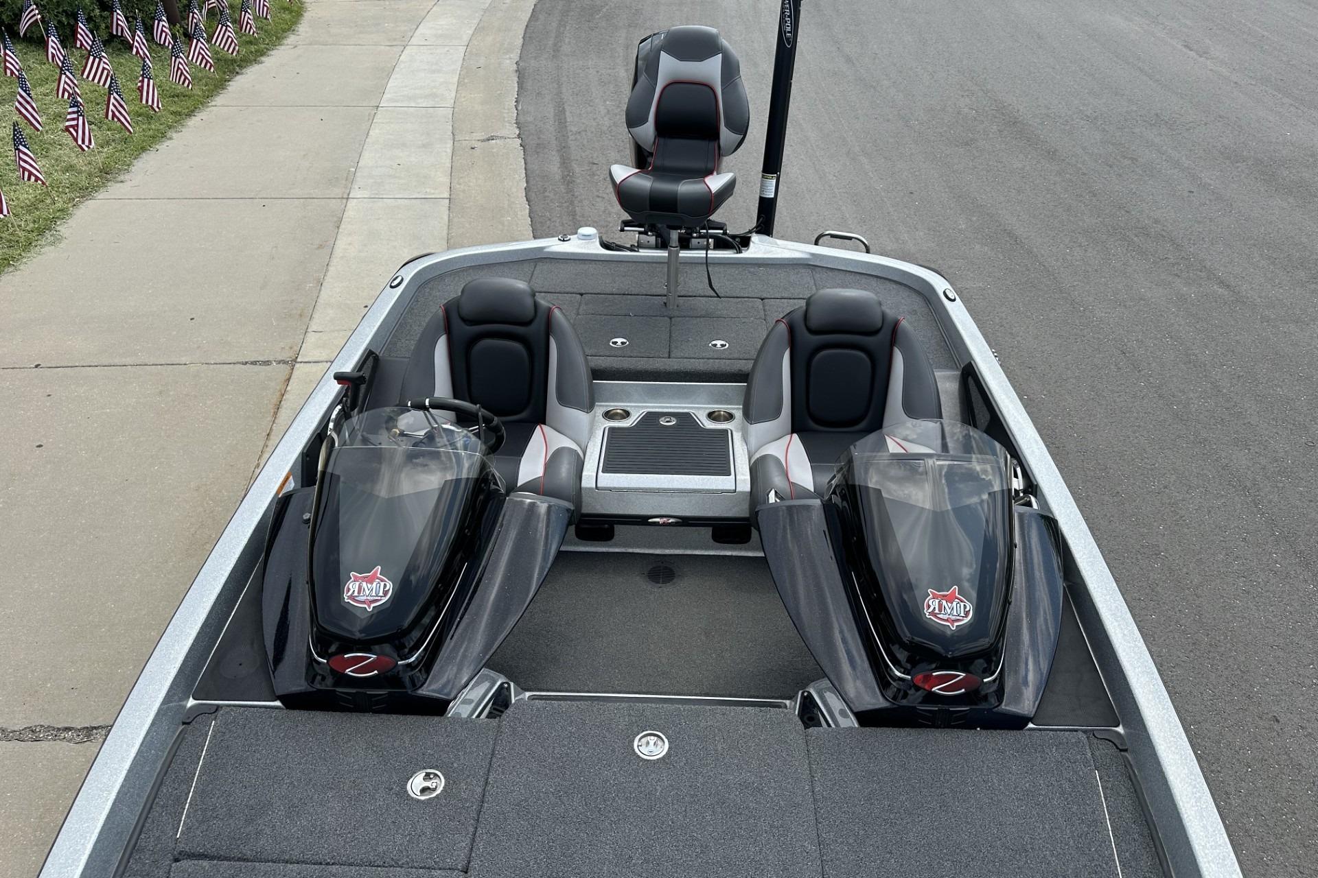 2018 Ranger Z518 boat with dual consoles and seating, parked on a roadside.