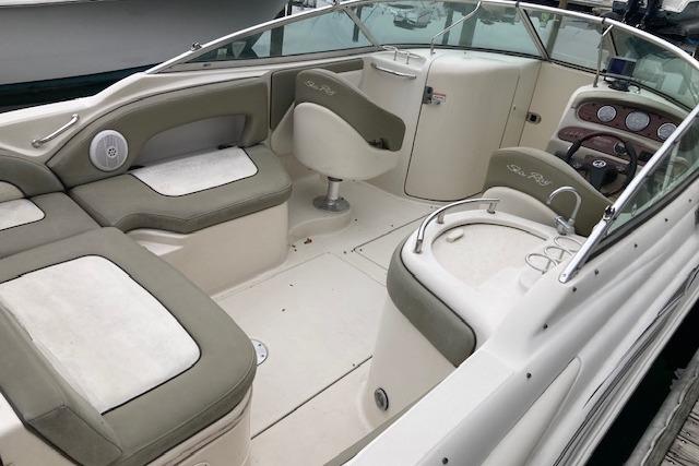 2006 Sea Ray 270 Sundeck interior with seating, helm, and dashboard.