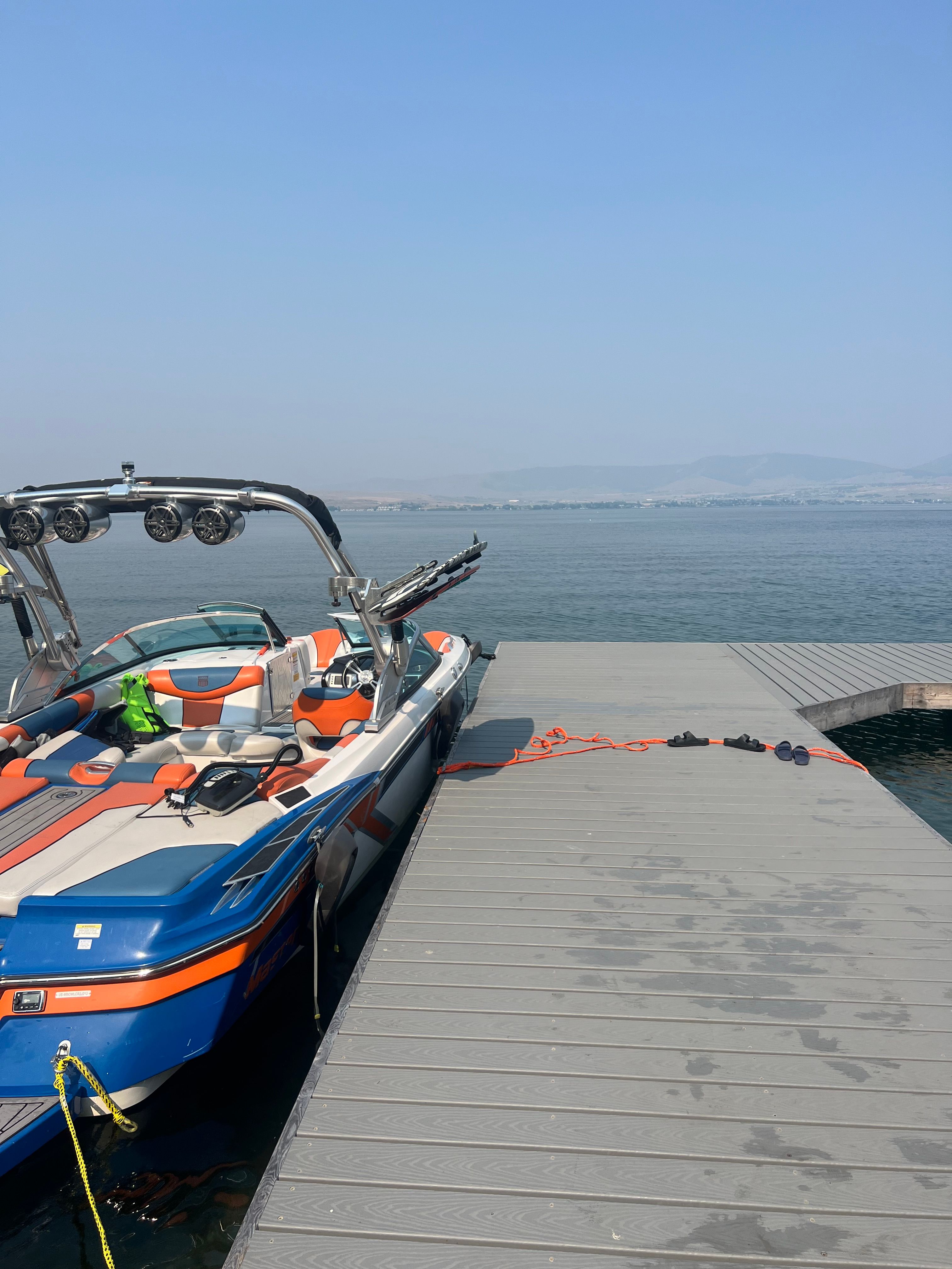 2013 MasterCraft XStar boat docked on calm water.