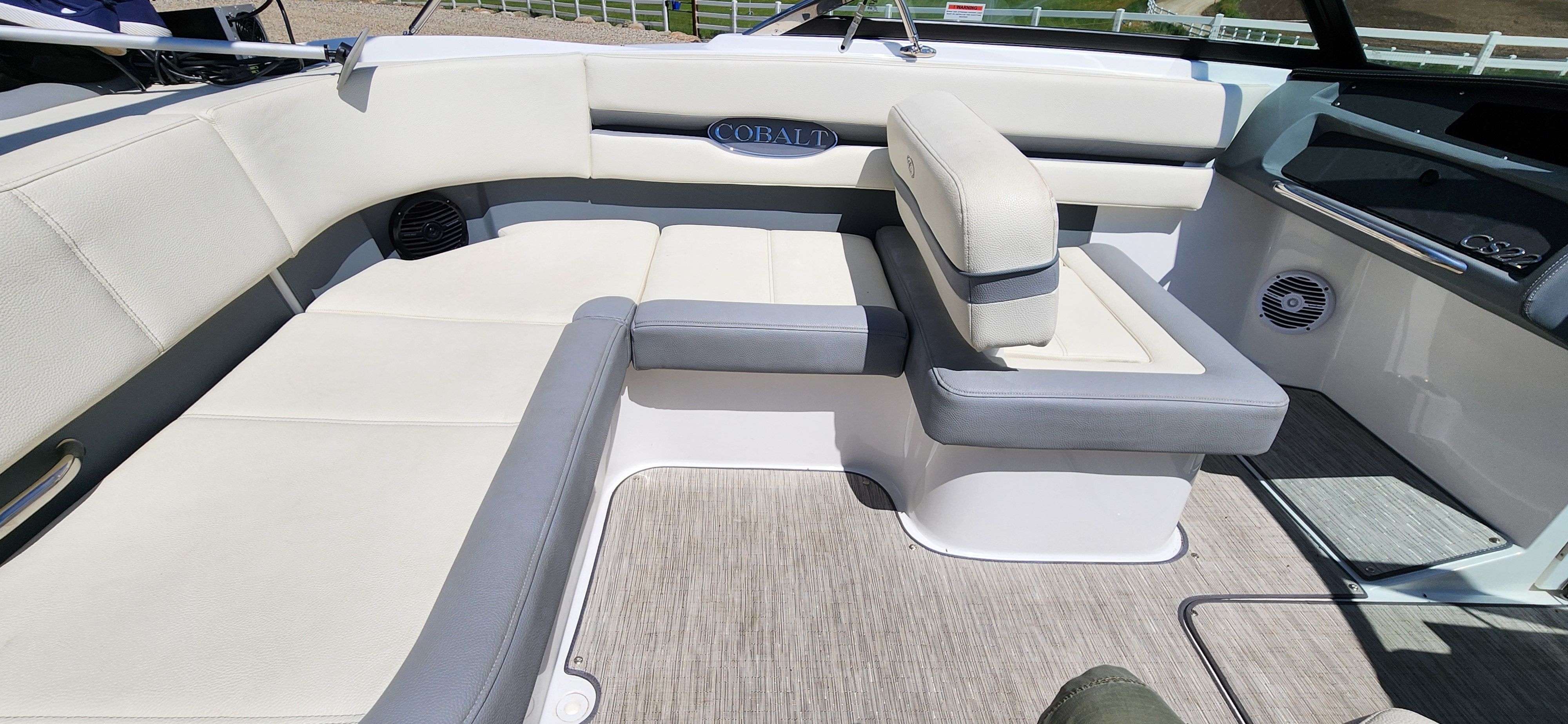Interior of a Cobalt CS22 boat with white and gray seating.