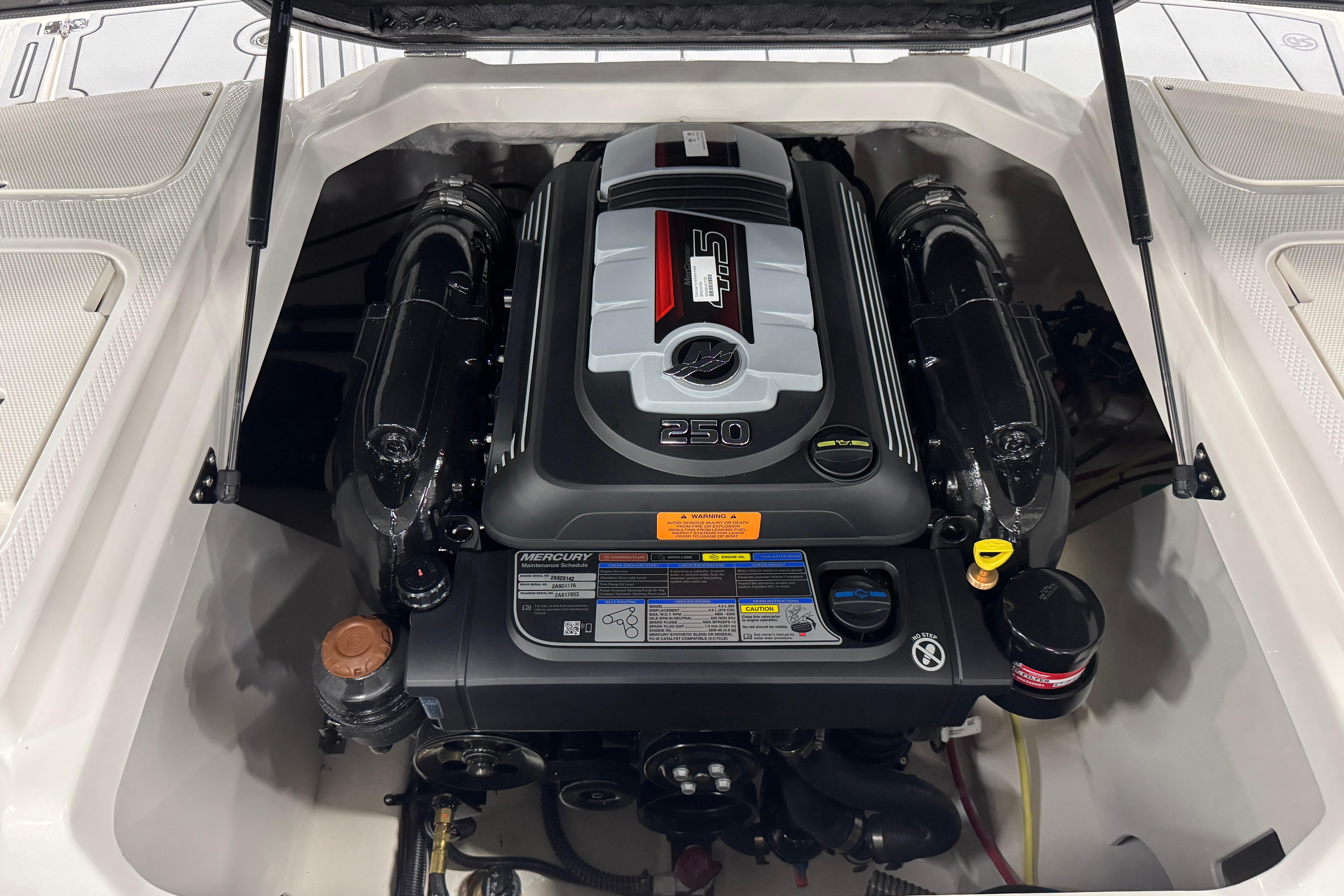 Engine compartment of 2026 Chaparral 21 SSi boat, featuring a powerful Mercury engine.