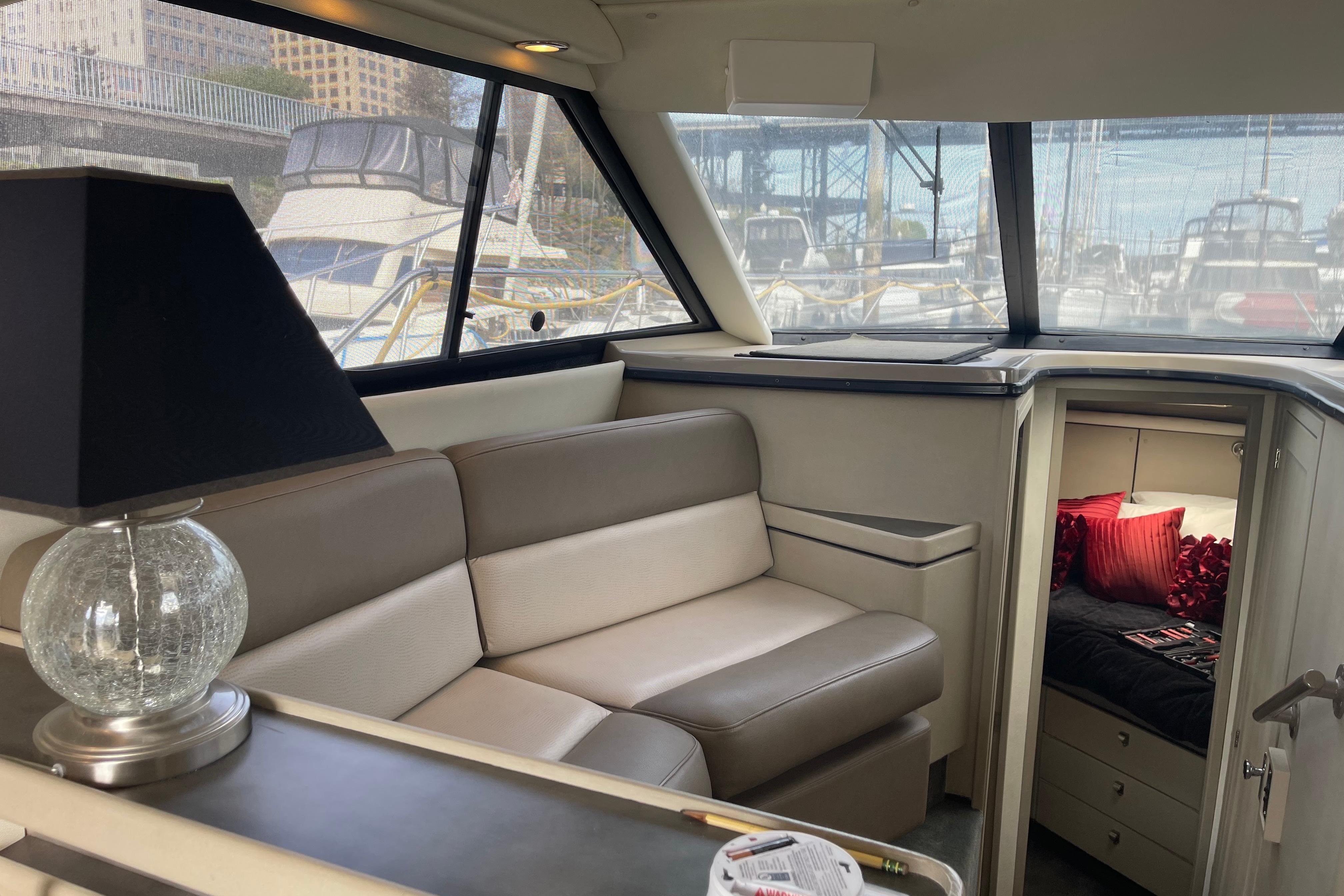 Interior of a 1996 Bayliner 3255 Avanti yacht with sofa and cabin view.
