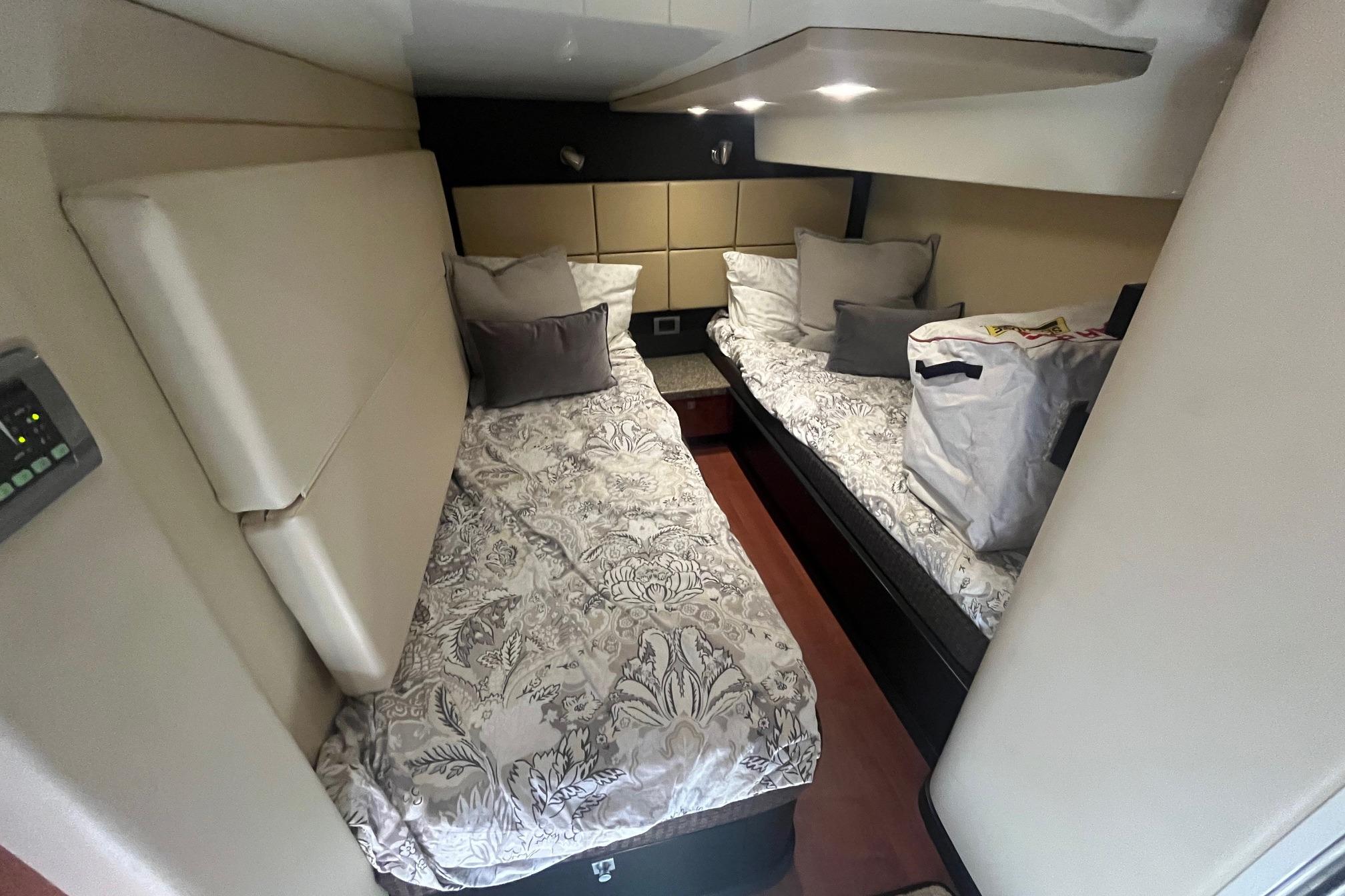 2010 Monterey 400 Sport Yacht cabin with twin beds and modern decor.