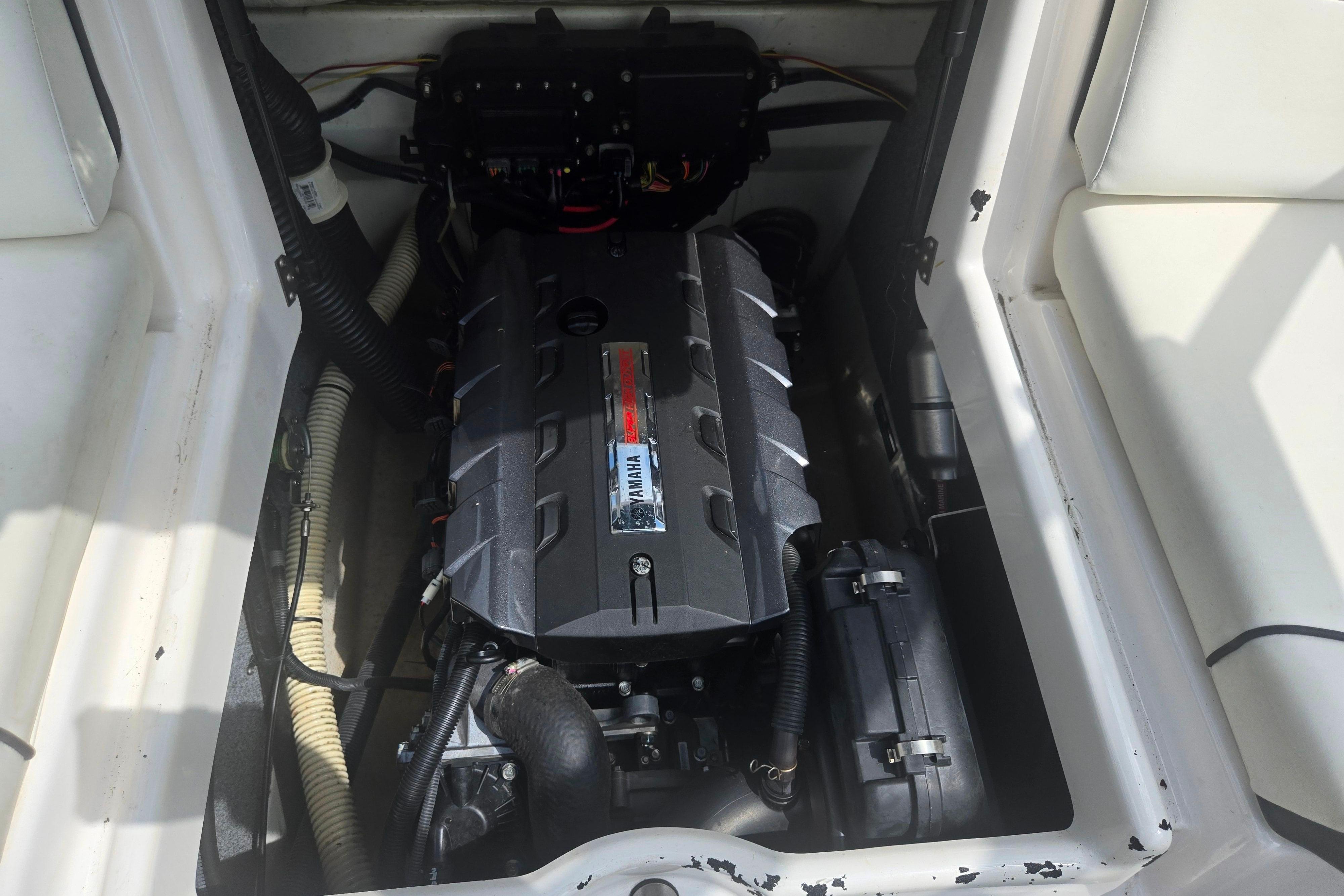 Engine compartment of a 2016 Yamaha Boats AR192, showcasing the engine and components.