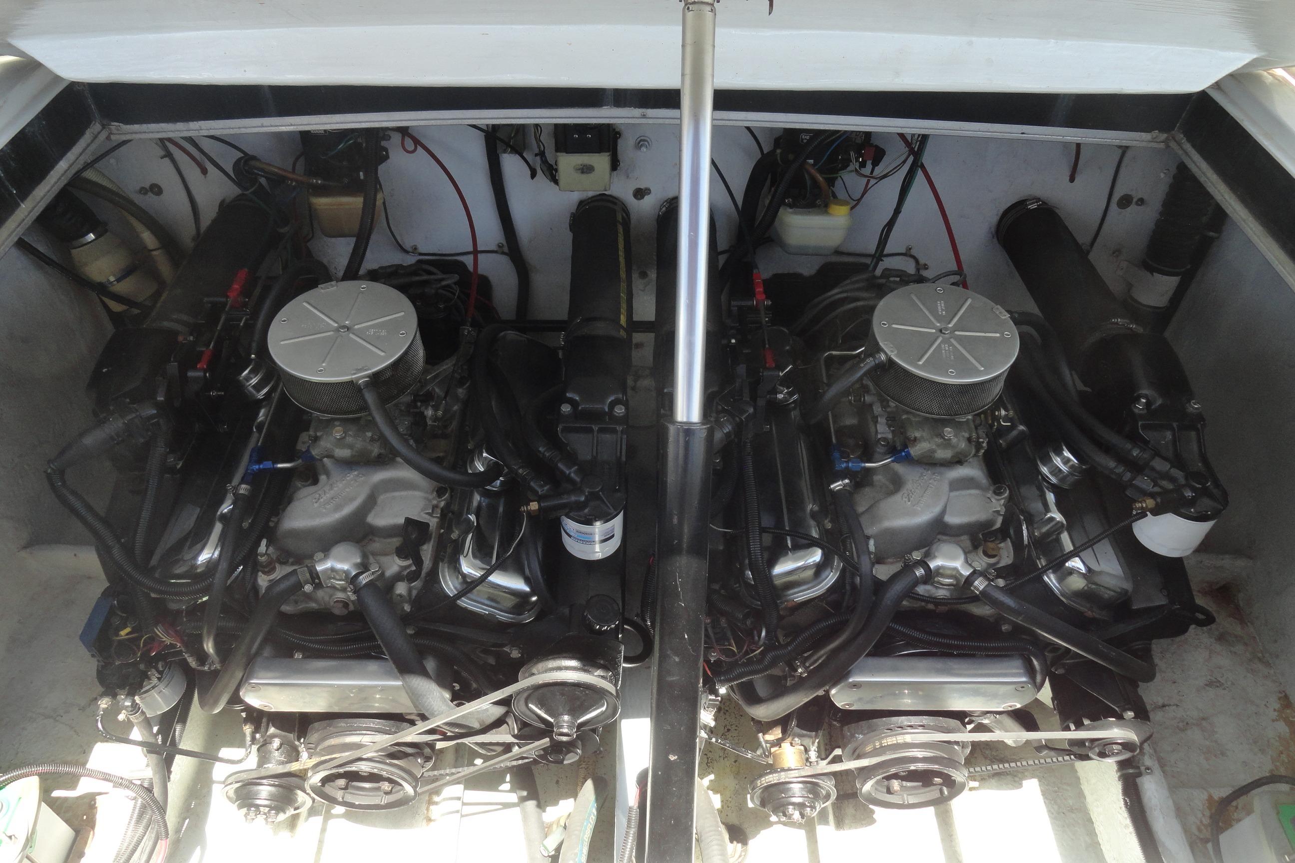 Twin engines of a 1988 Wellcraft 34 Scarab boat, showcasing detailed mechanical components.