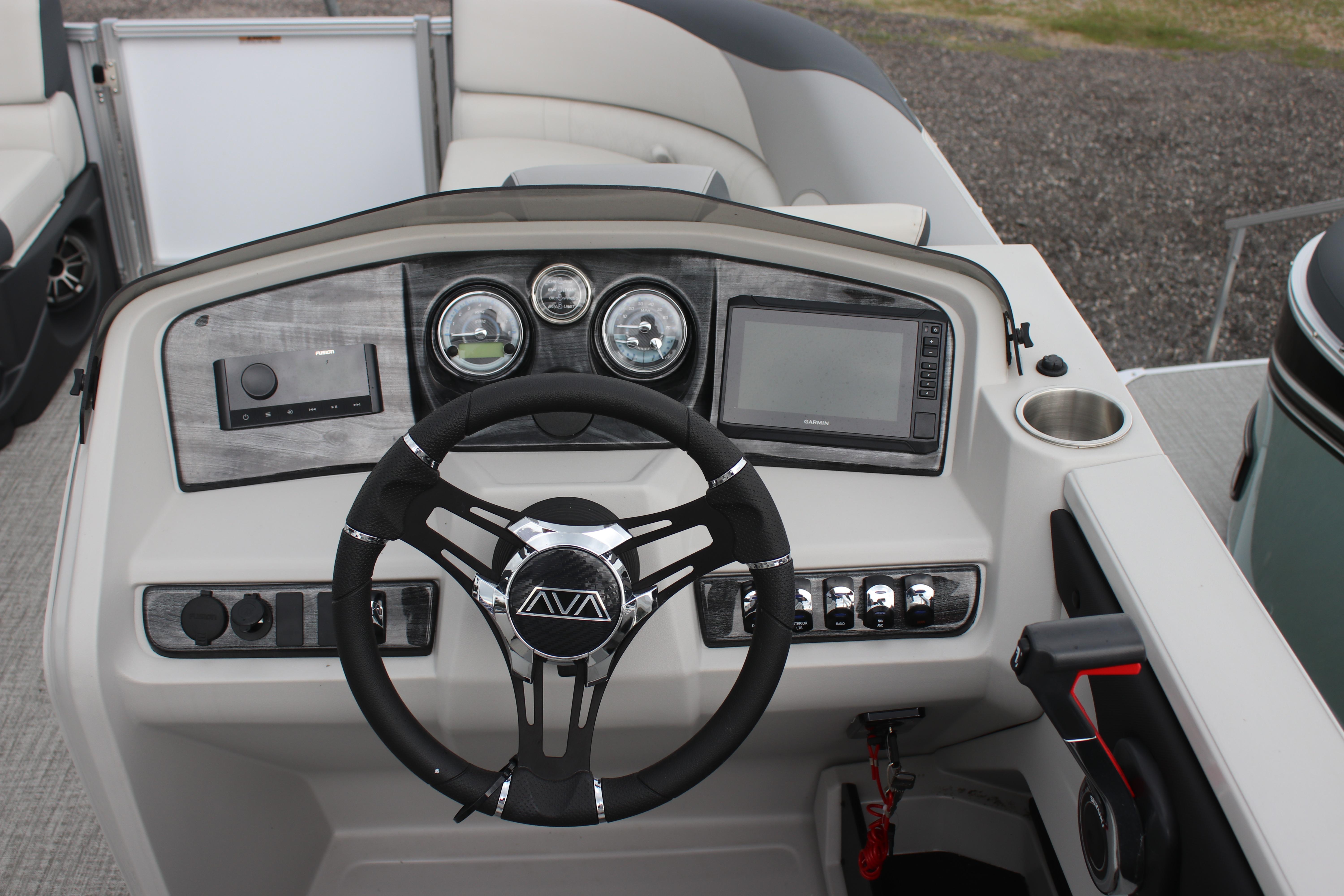 2025 Avalon LSZ Quad Lounger dashboard with steering wheel, gauges, and control panel.