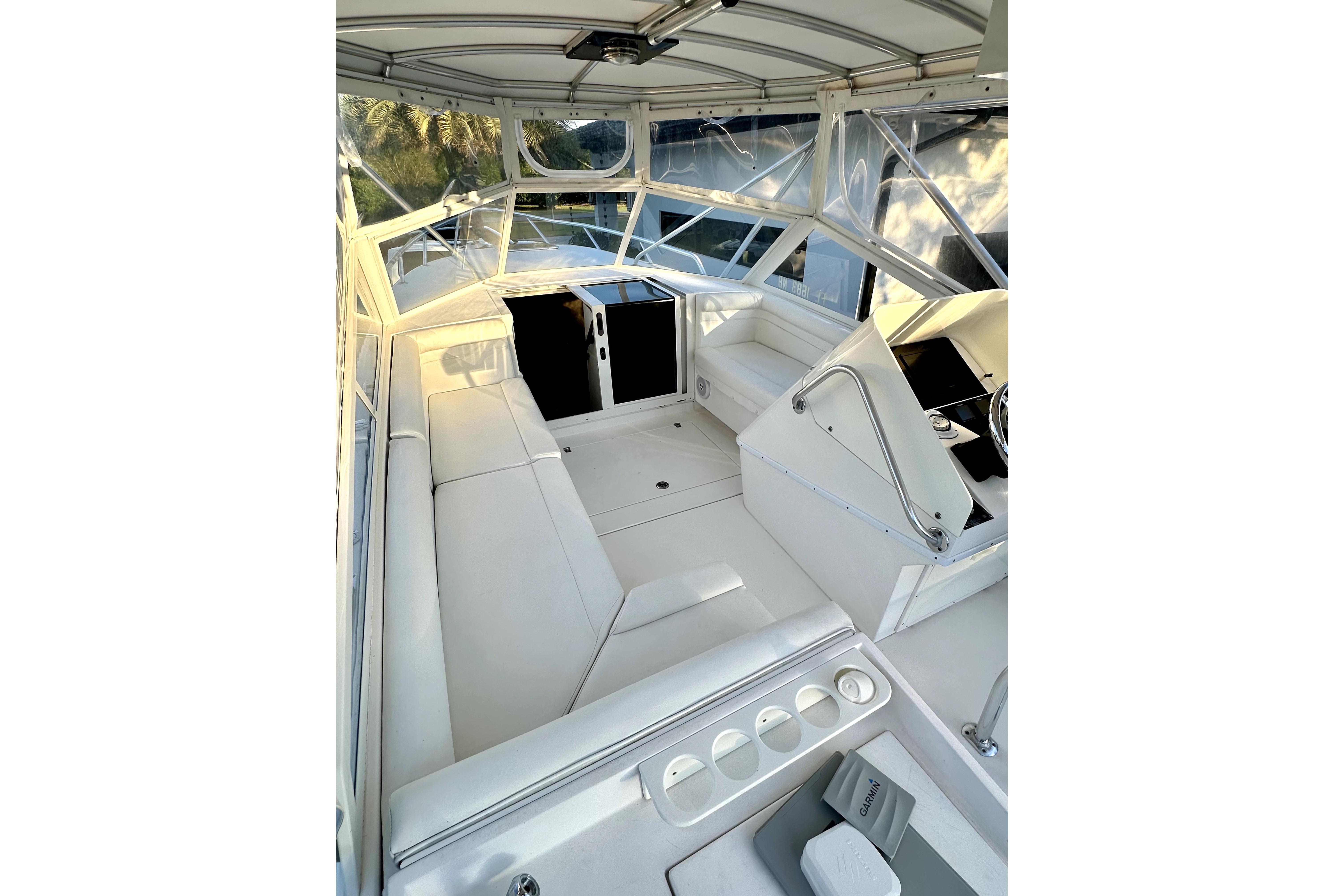 2006 Contender 35 Express Side Console boat interior with white seating and helm.