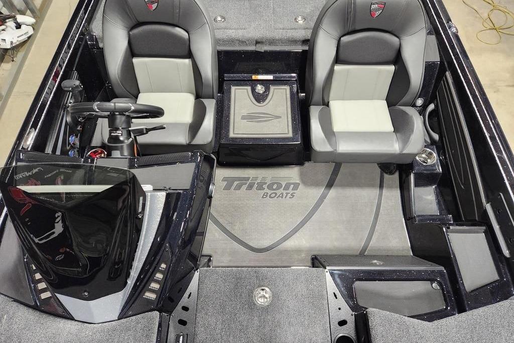 2026 Triton 20XP Patriot boat interior with dual seats and steering console.