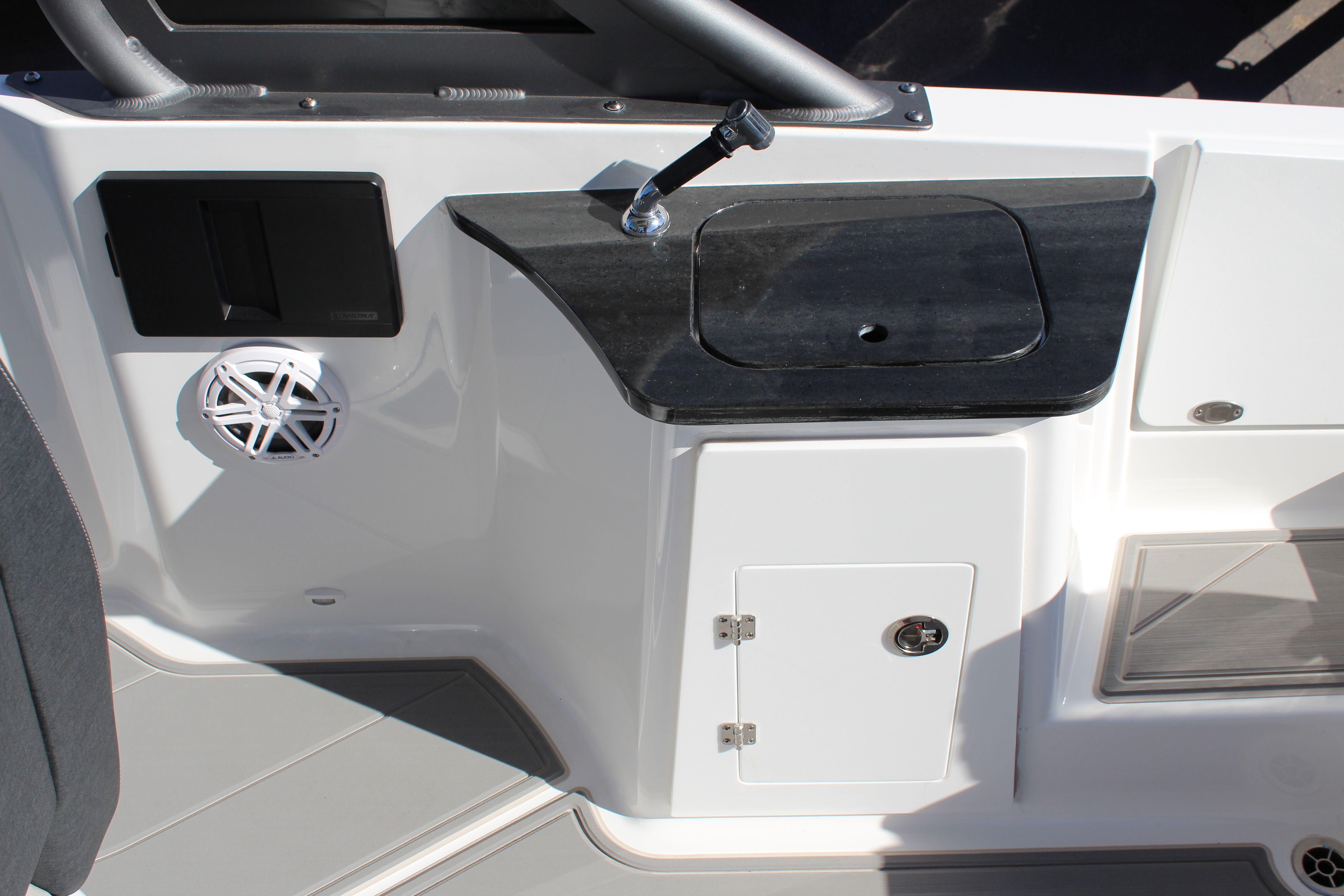 Interior of 2025 Monterey Elite 27 OB with speaker and storage.