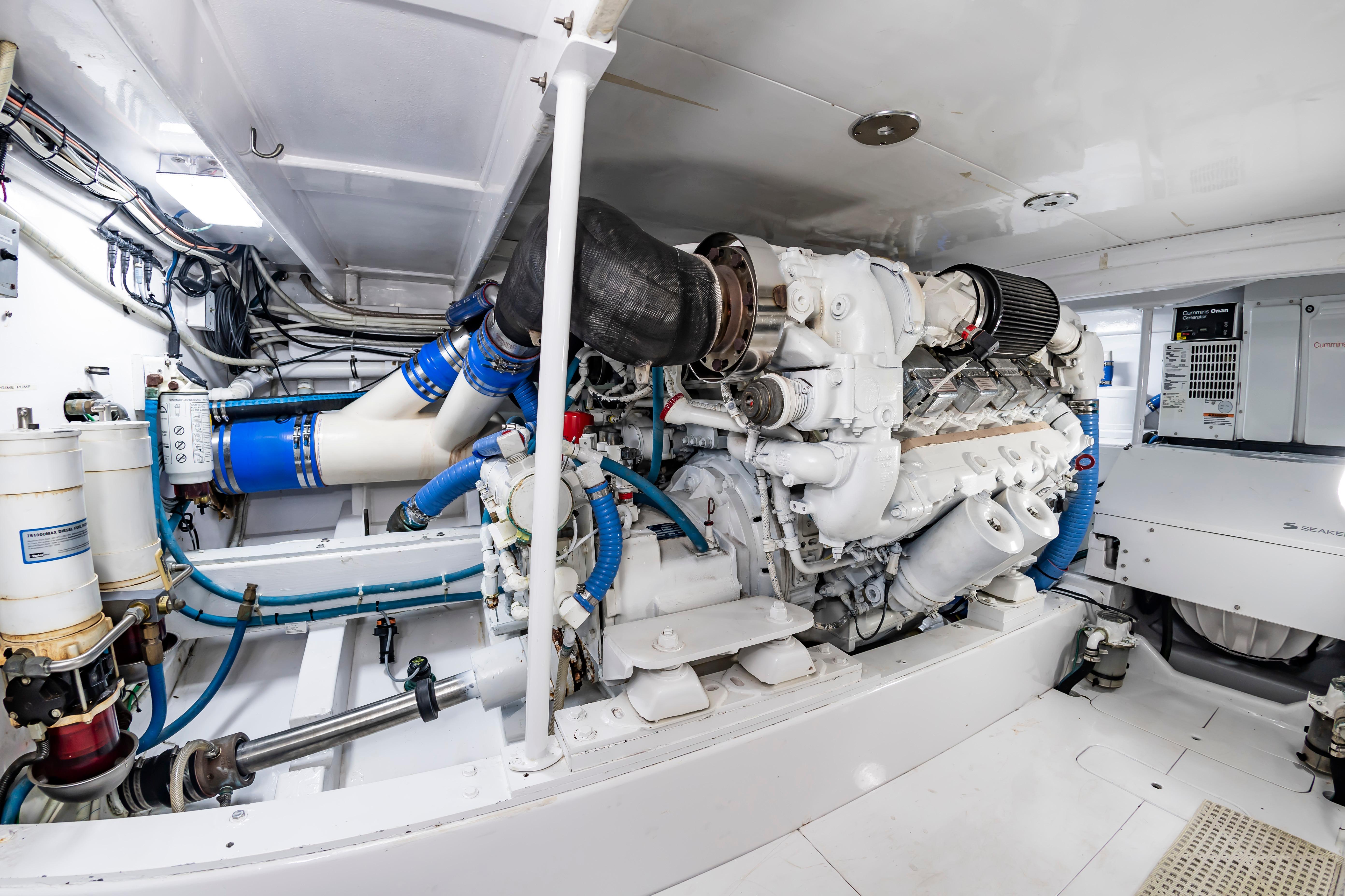 Engine room of 1993 Custom Carolina Scarborough 56 Convertible yacht, showcasing machinery and components.
