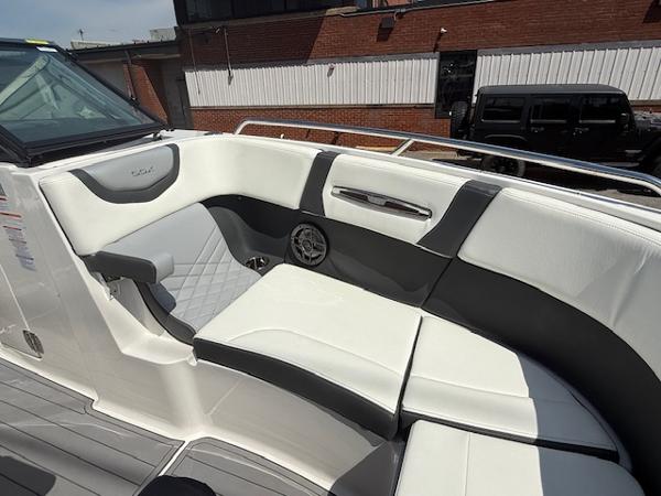 2023 Chaparral 267 SSX boat interior with white and gray seating, modern design.