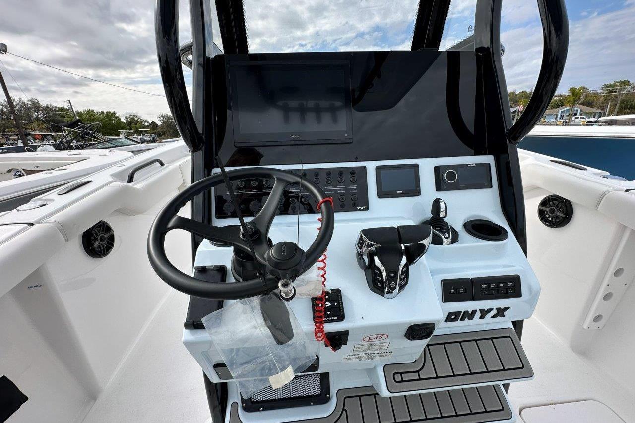 2026 Tidewater 272 LXF boat dashboard with steering wheel and control panel.