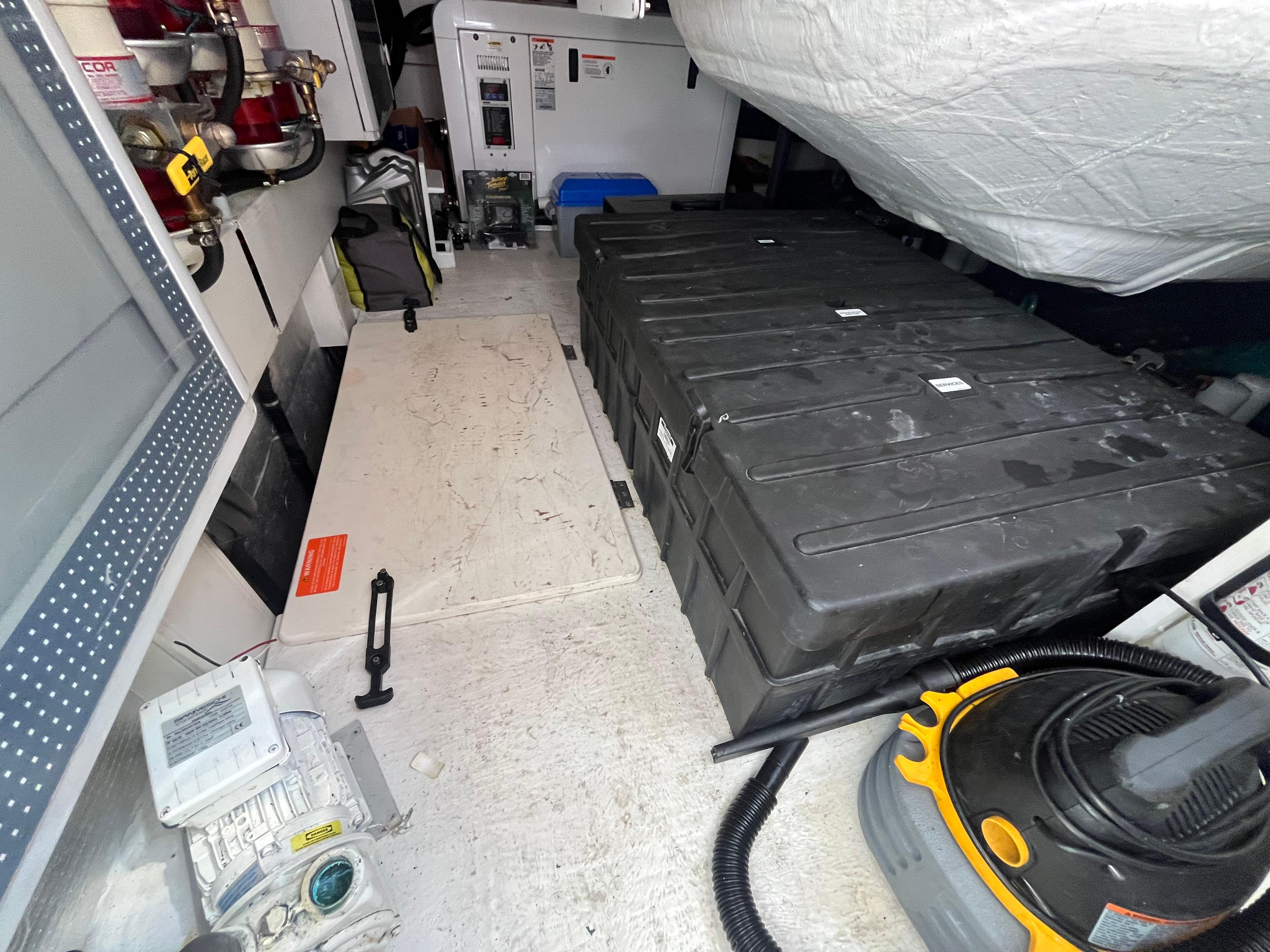 Engine room of a 2014 Azimut 55S yacht with equipment and storage.