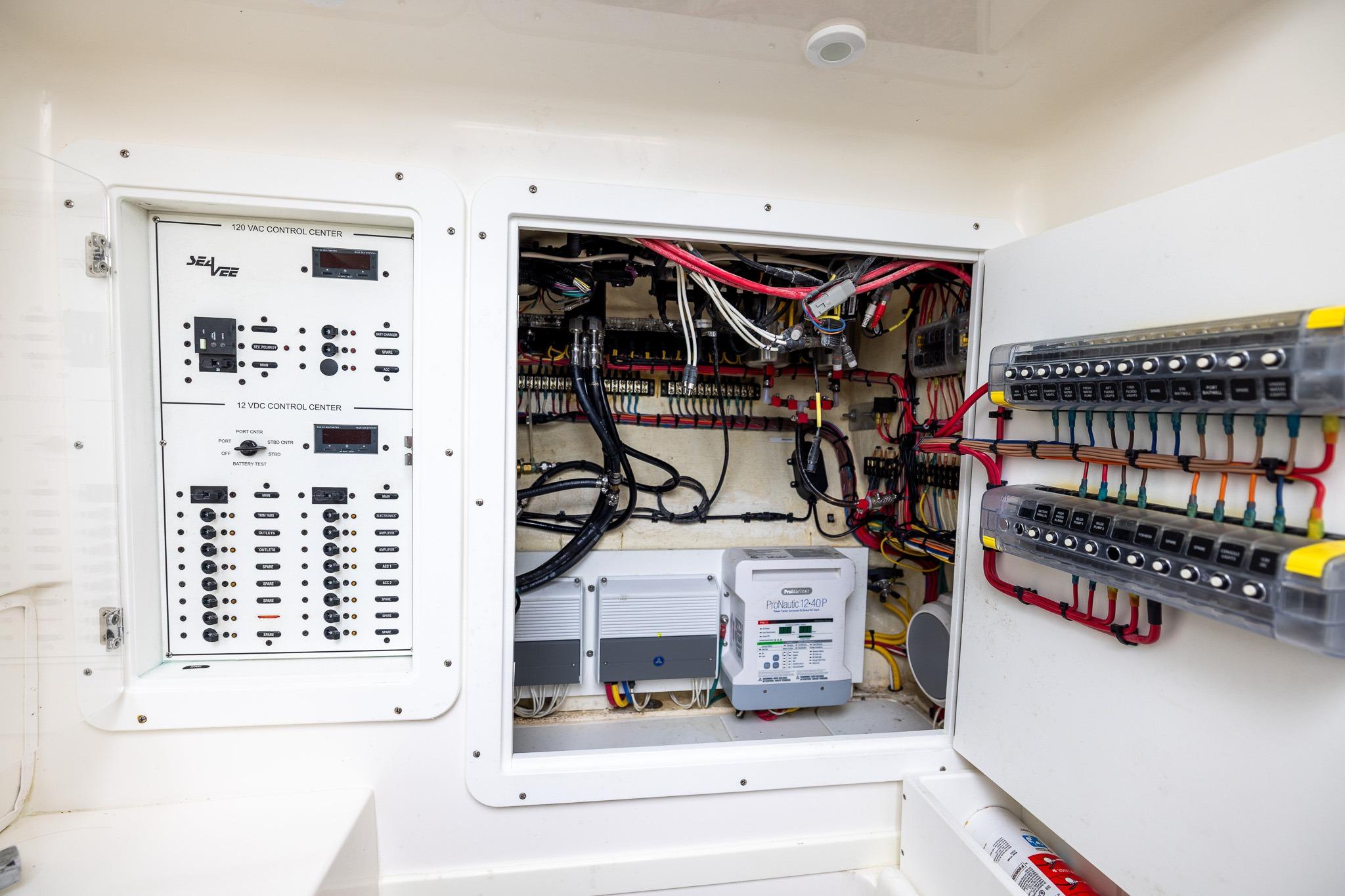 Electrical control panel of 2019 SeaVee 322Z boat, showcasing wiring and circuit systems.