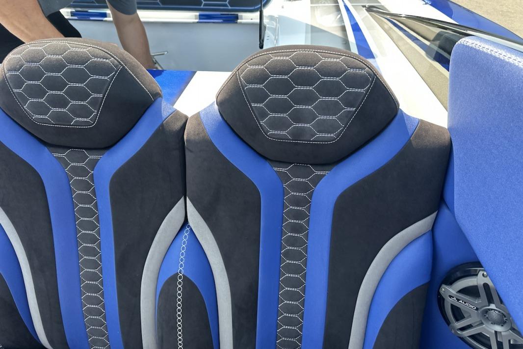 Blue and black seats in a 2018 Wright Performance 420 boat interior.