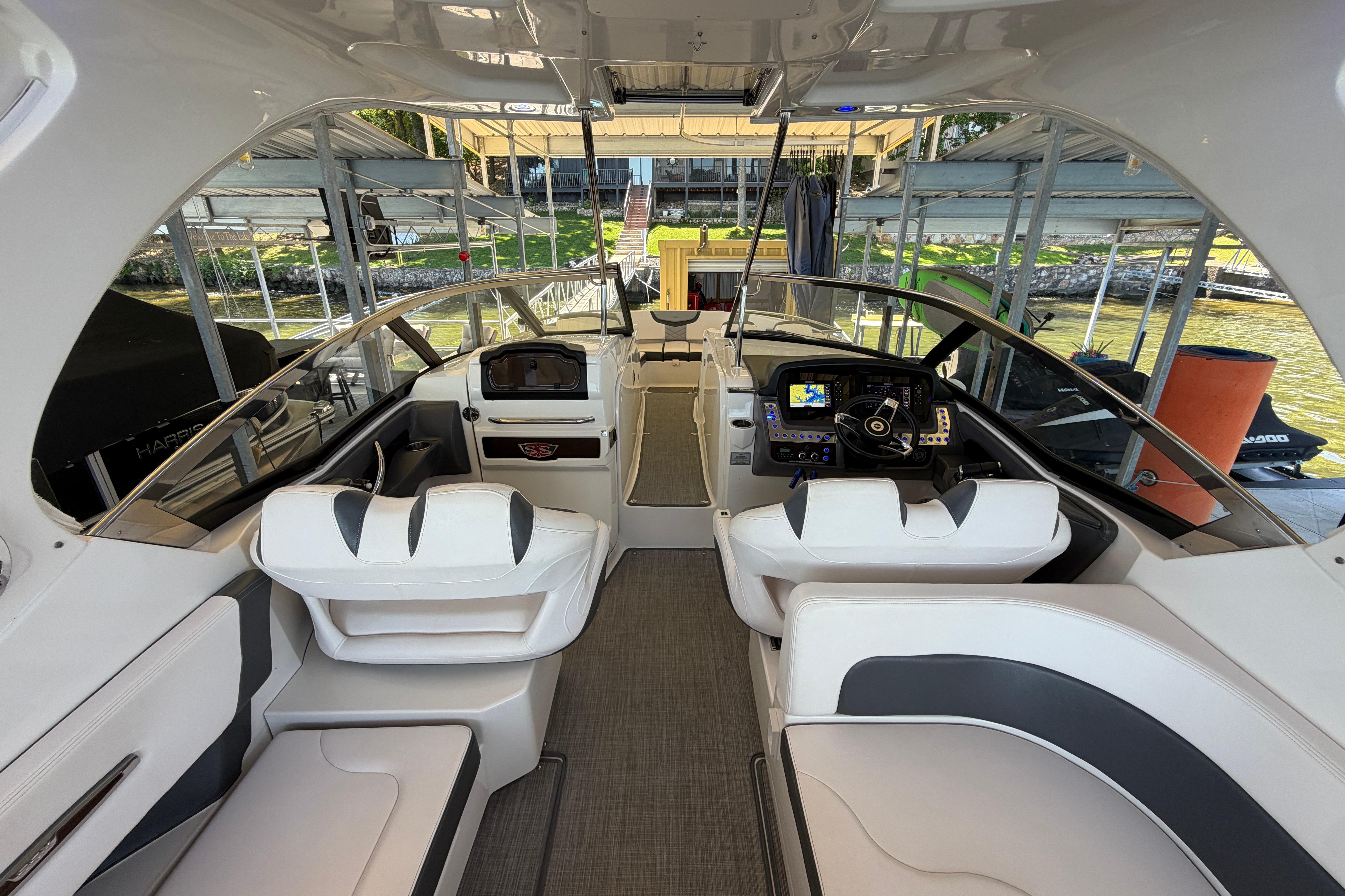 Interior view of 2018 Chaparral 347 SSX boat, featuring sleek seating and modern dashboard.