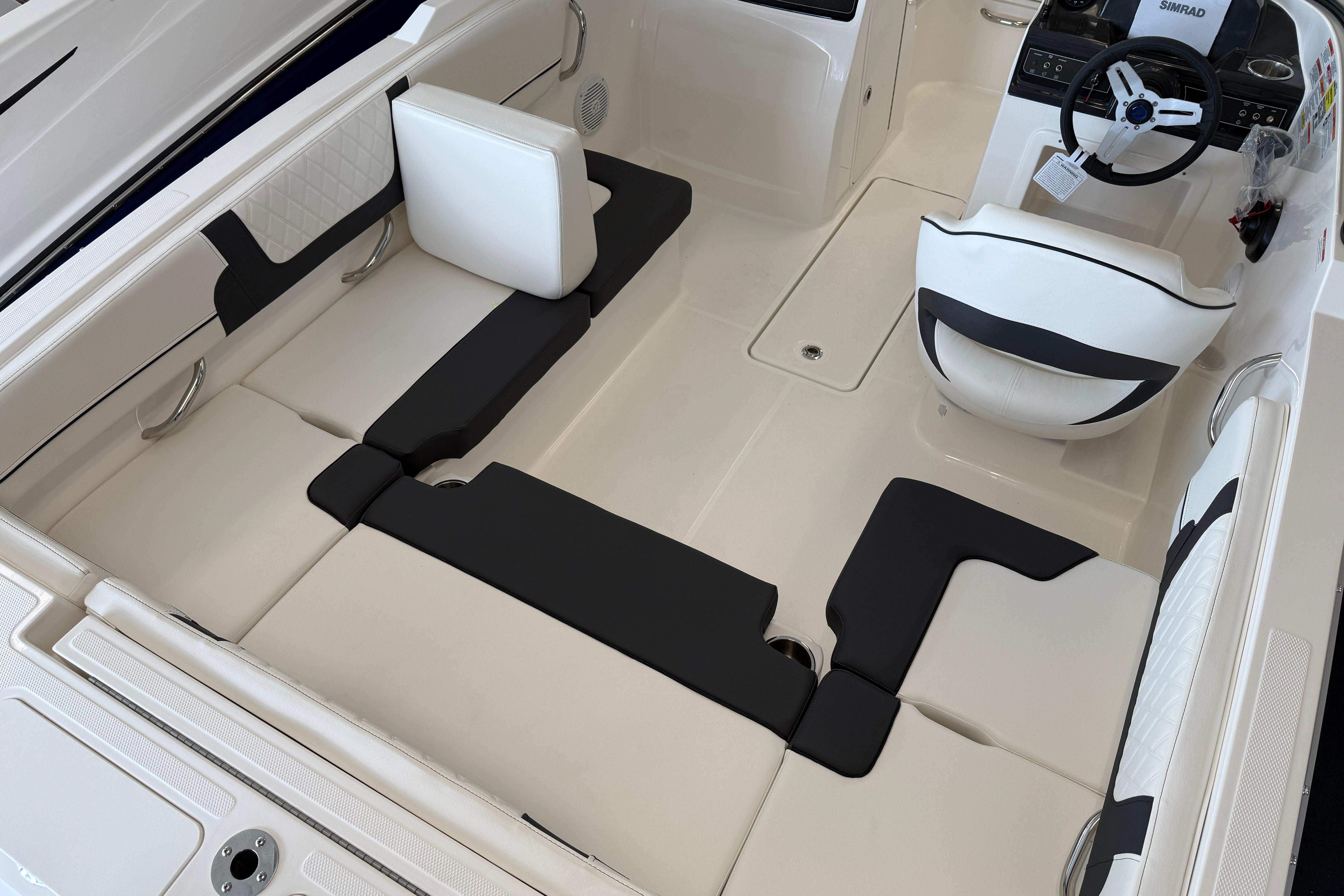 2025 Bayliner VR4 Bowrider OB interior with modern seating and steering wheel.