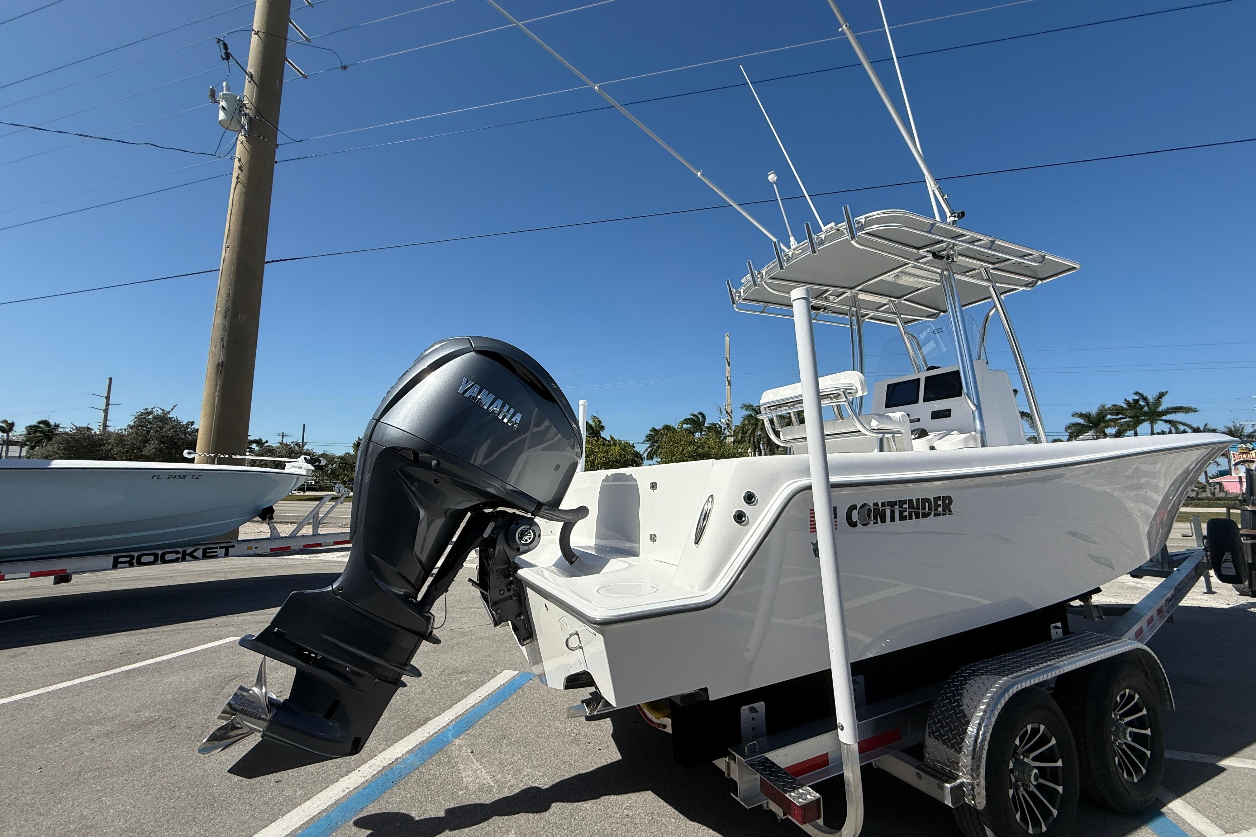 2026 Contender 25 Tournament boat with Yamaha outboard engine on trailer.