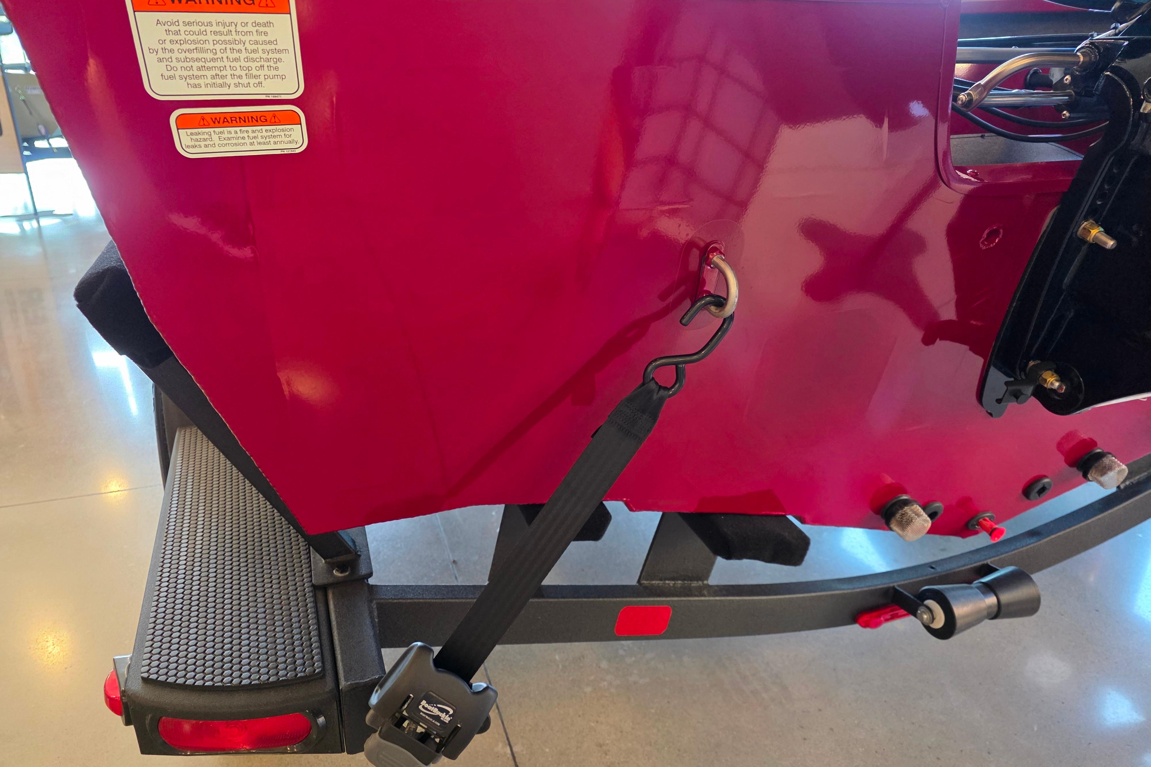 2026 Ranger VS1782SC Reata boat trailer with red hull and safety warnings.