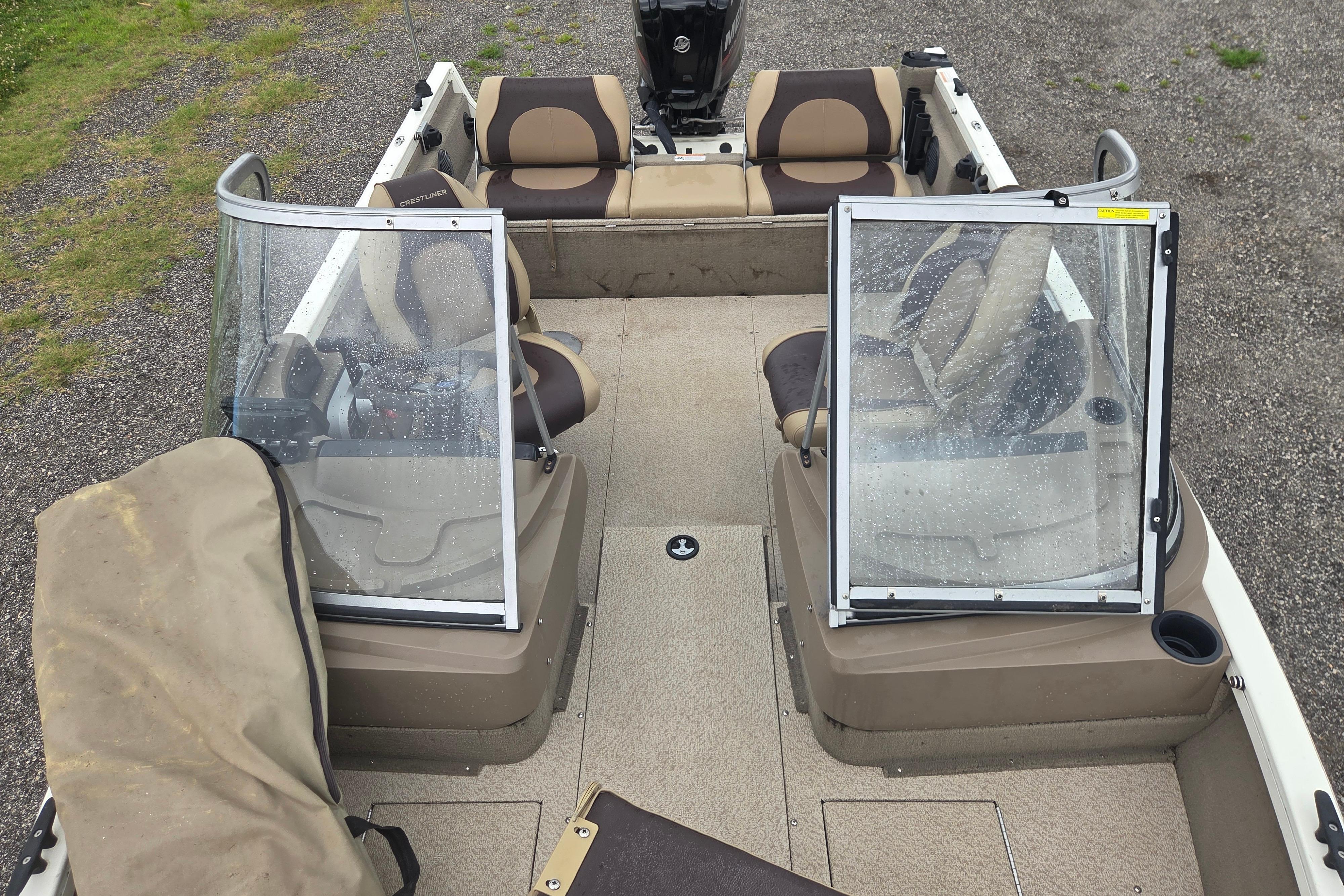 2016 Crestliner 1650 Fish Hawk SC boat interior with seating and windshield.