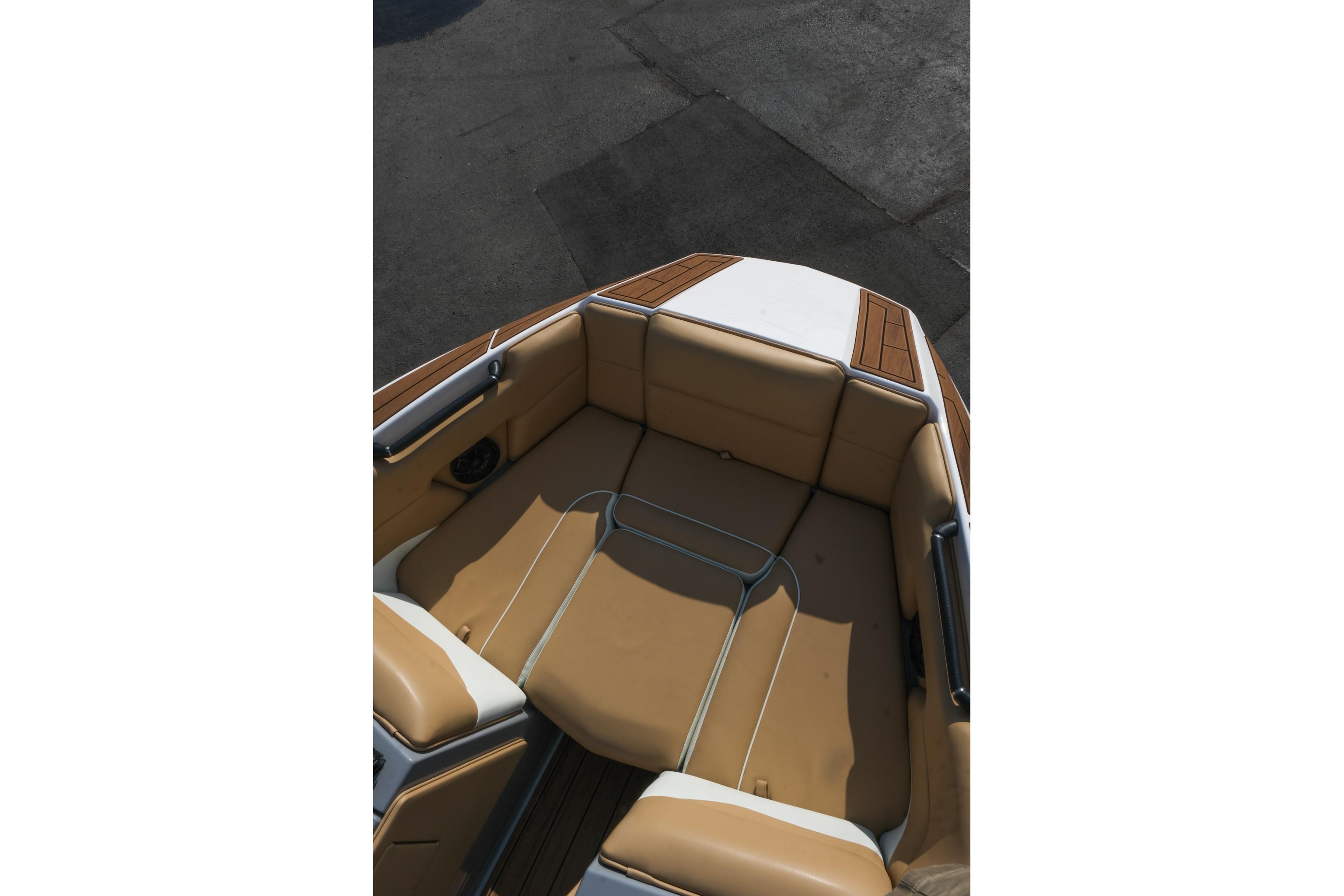 2023 Moomba Mondo boat interior with tan seating and wood accents.