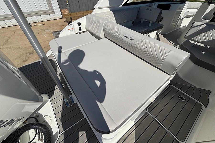 2027 Sea Ray SDX 230 Outboard boat interior with cushioned seating and sleek design.