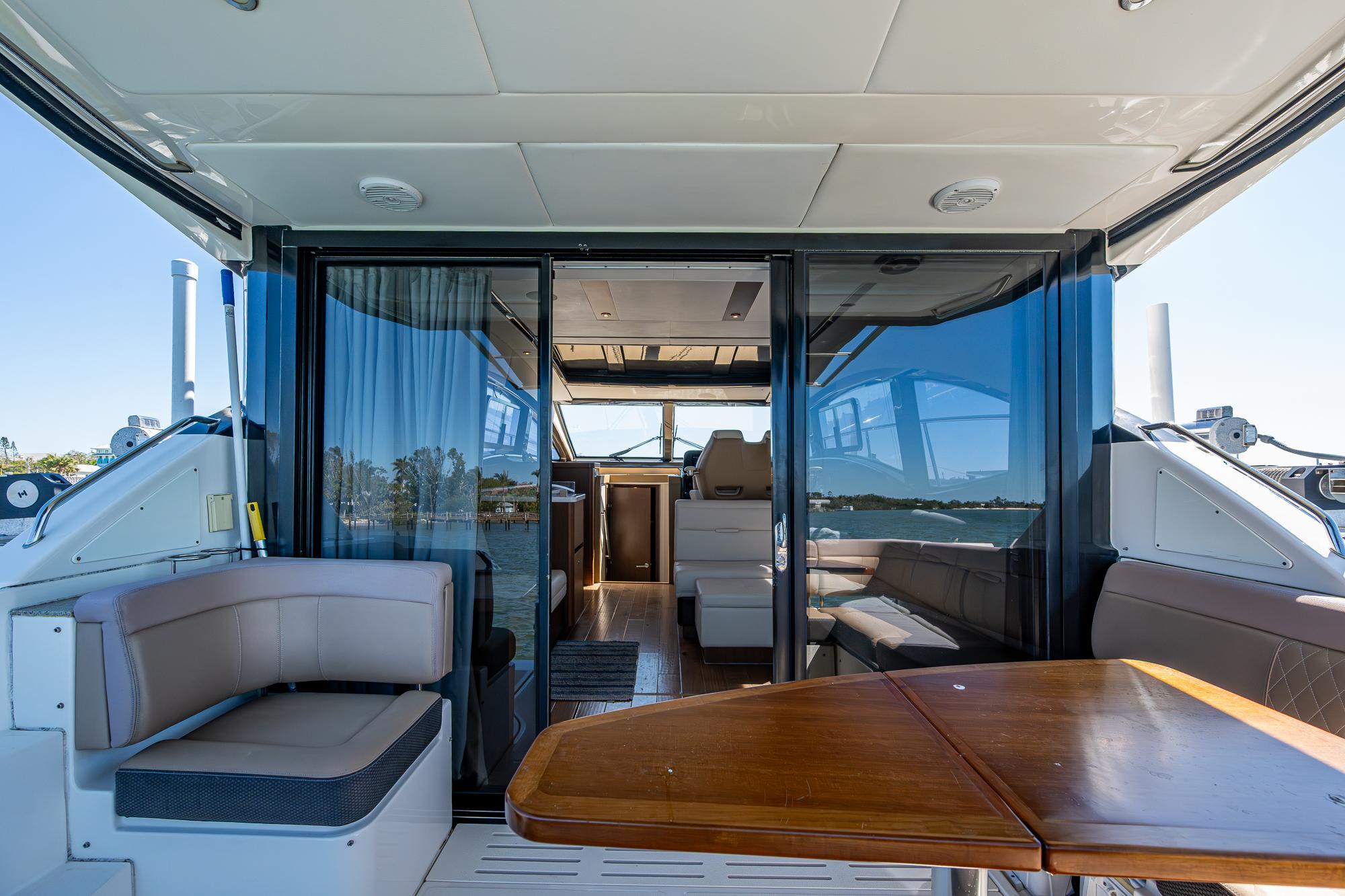 2017 Sea Ray Sundancer 400 yacht interior with seating and table.