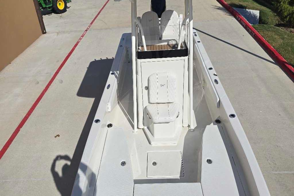 2025 Ranger 2360 Bay boat on concrete, showcasing deck and seating area.
