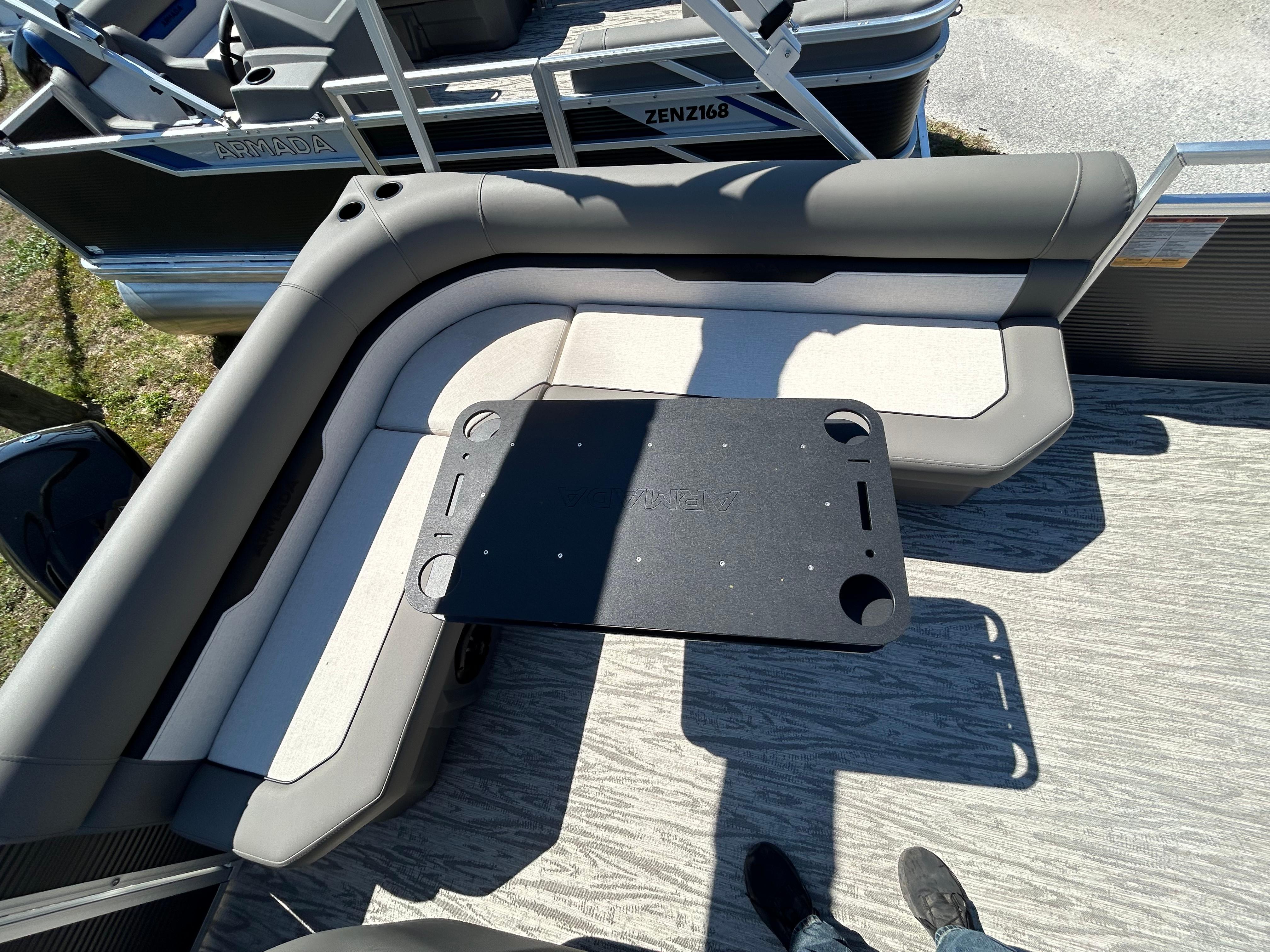Armada Z-168 2025 boat interior with cushioned seating and table.