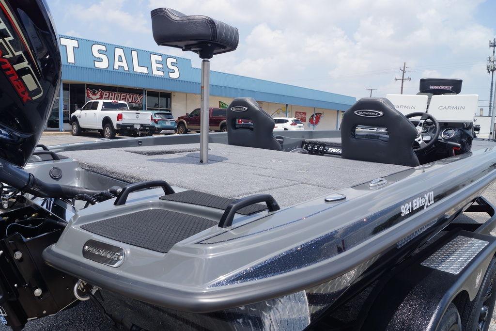 2027 Phoenix 921 Elite X II boat displayed at dealership, featuring Garmin electronics.